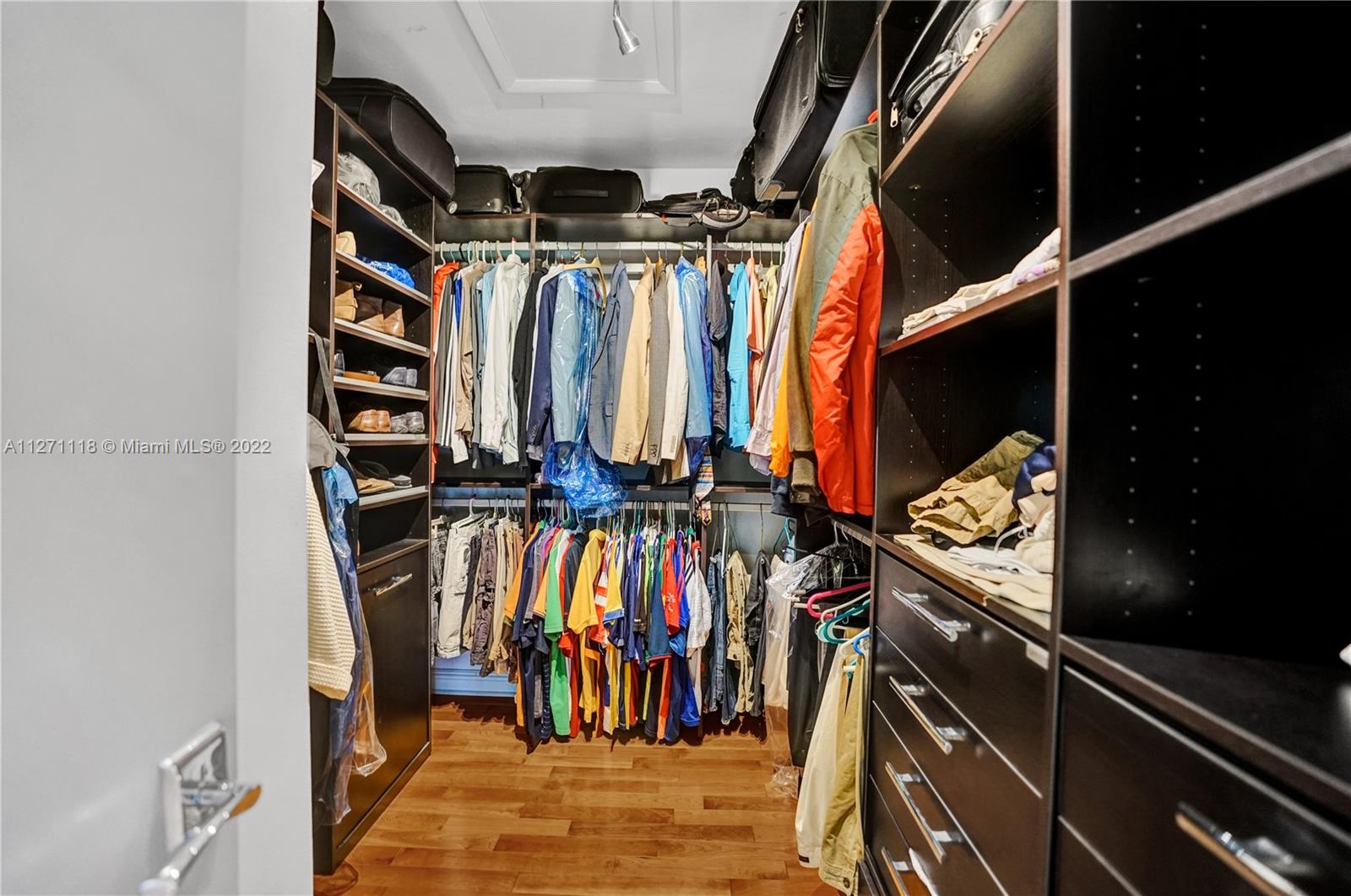 His and Hers Custom Cabinetry Walk-in Closets