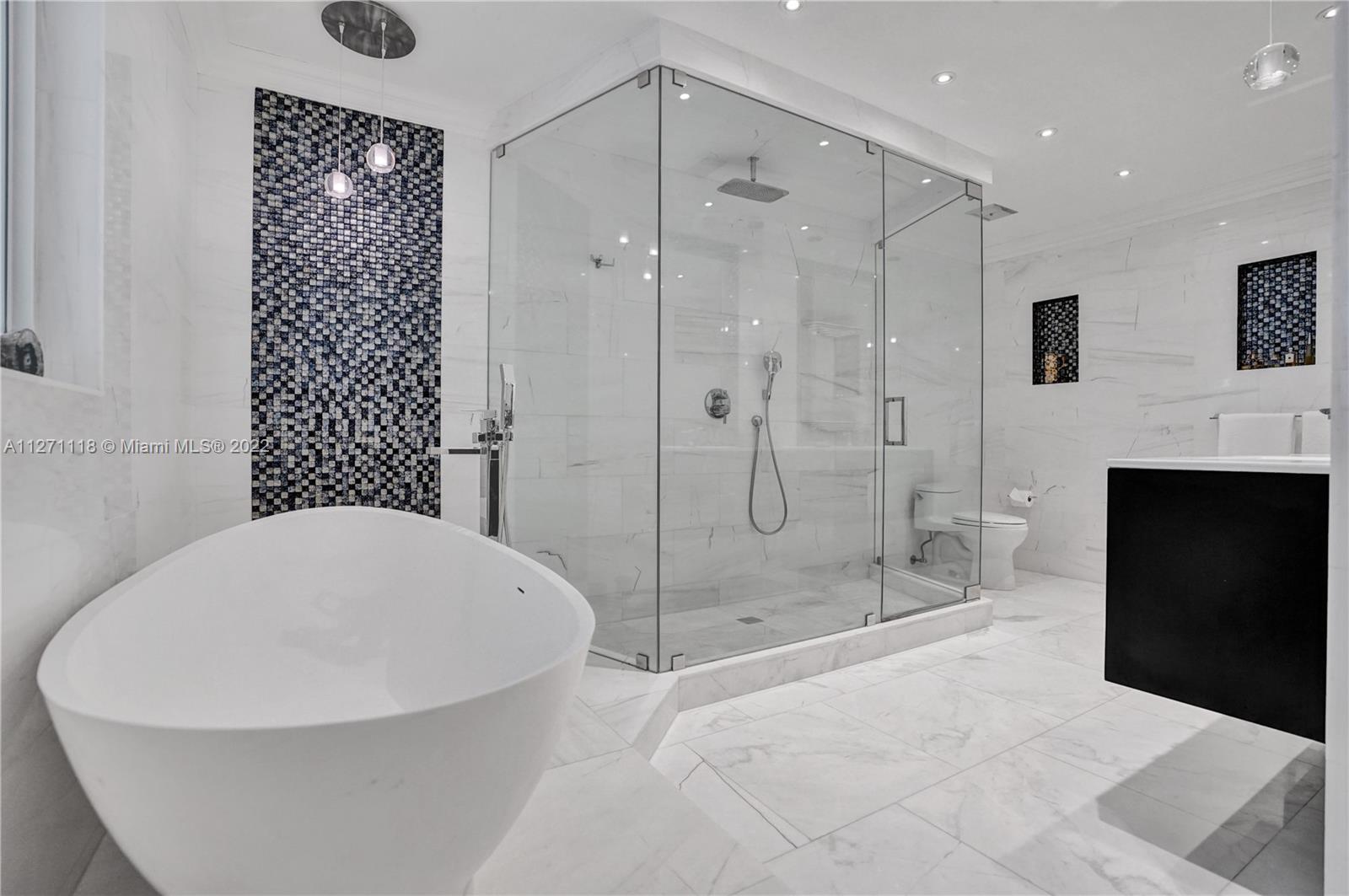 Marble Luxury in Master Bath. Designer Mosiac Mural.