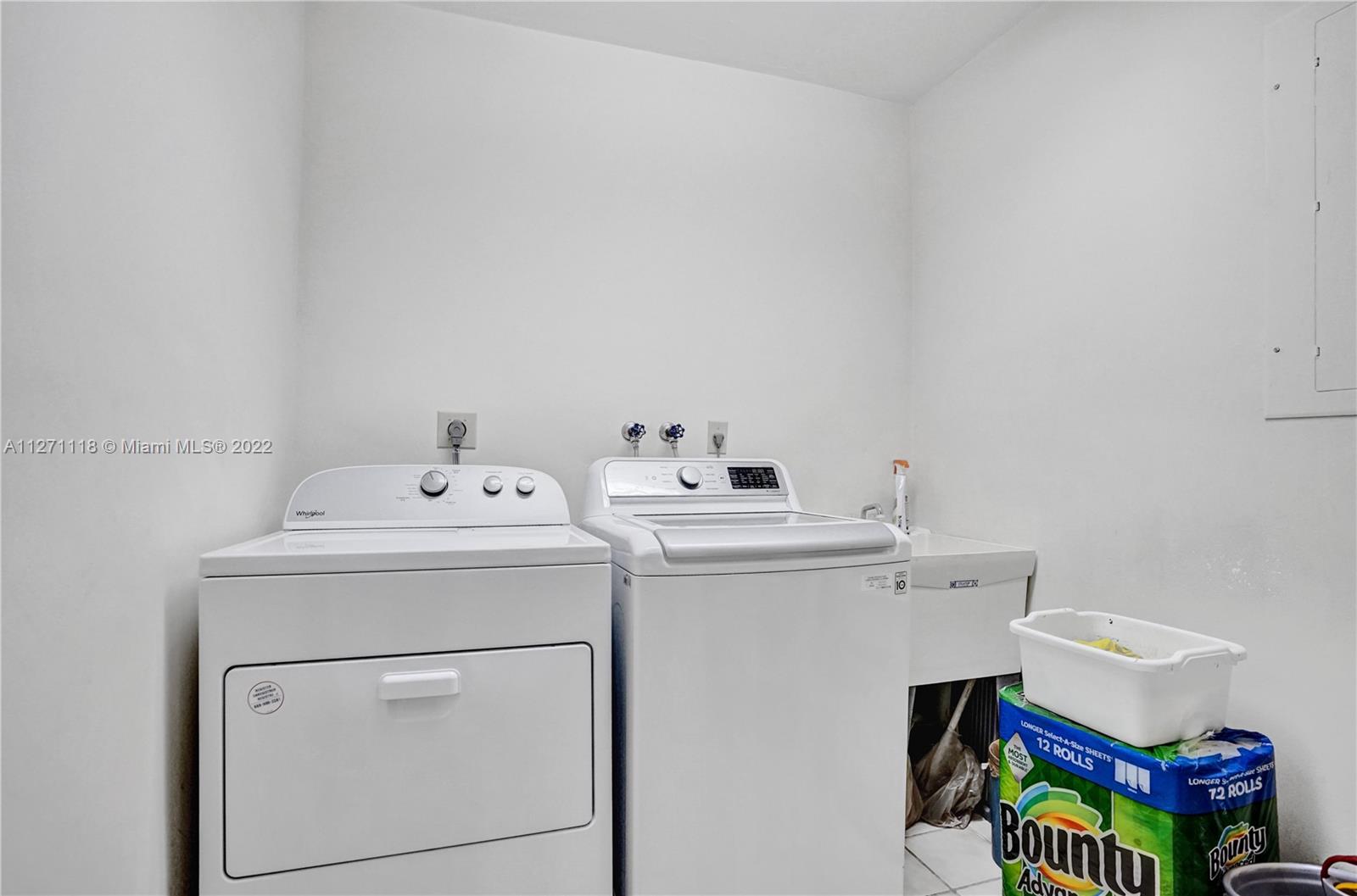 Separate Laundry Room with Large Storage Closet