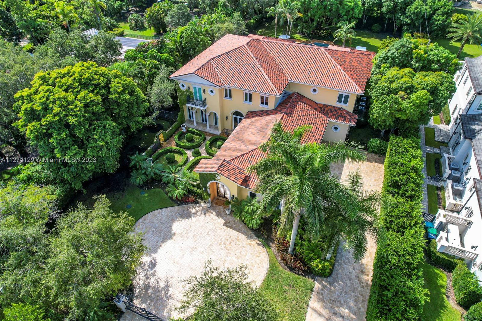 The tone is set for this unmatched Estate upon arrival, as a perfect balance between intricate details & grandiose architectural elements exude. Perfectly located on a quiet cul-de-sac in North Pinecrest, this Italian-style villa is designed to perfection. This art piece of a mansion was brought to life with precise details & baroque finishes, featuring stunning artisan inlaid marble, alabaster stone, & wrought iron. A massive oval foyer boasts 30FT dome ceilings & hand-painted frescos. 7 en suite bedrooms. A chef's kitchen features Subzero, Thermador, & Dacor. Huge motor court 4-car garage. The Estate's manicured grounds consist of a therapeutic Topiary Garden, courtyards, 40-FT Roman style pool, & spa. Cabana bath. Offering you style & comfort with endless possibilities.