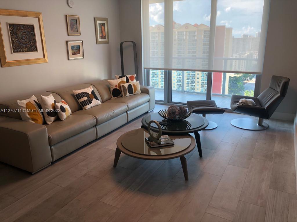 Come enjoy this spectacular and spacious two-bedroom, three-bathroom residence in Parque Tower,  conveniently located in the center of Sunny Isles, just steps from the beach.  This stunning condo offers unobstructed city and bay views, wood floors throughout, stainless steel appliances, floor-to-ceiling windows, and a generous-sized balcony. The building offers 24-hour security, assigned parking, swimming pools, a gym, several lounge areas, a business center, a movie theater, a kids' playground and pool, a dry and wet sauna, a clubhouse, and a cigar room. Walking distance to all shops and restaurants, short drive to Aventura Mall, and Bal Harbour Shops.
The unit is furnished.