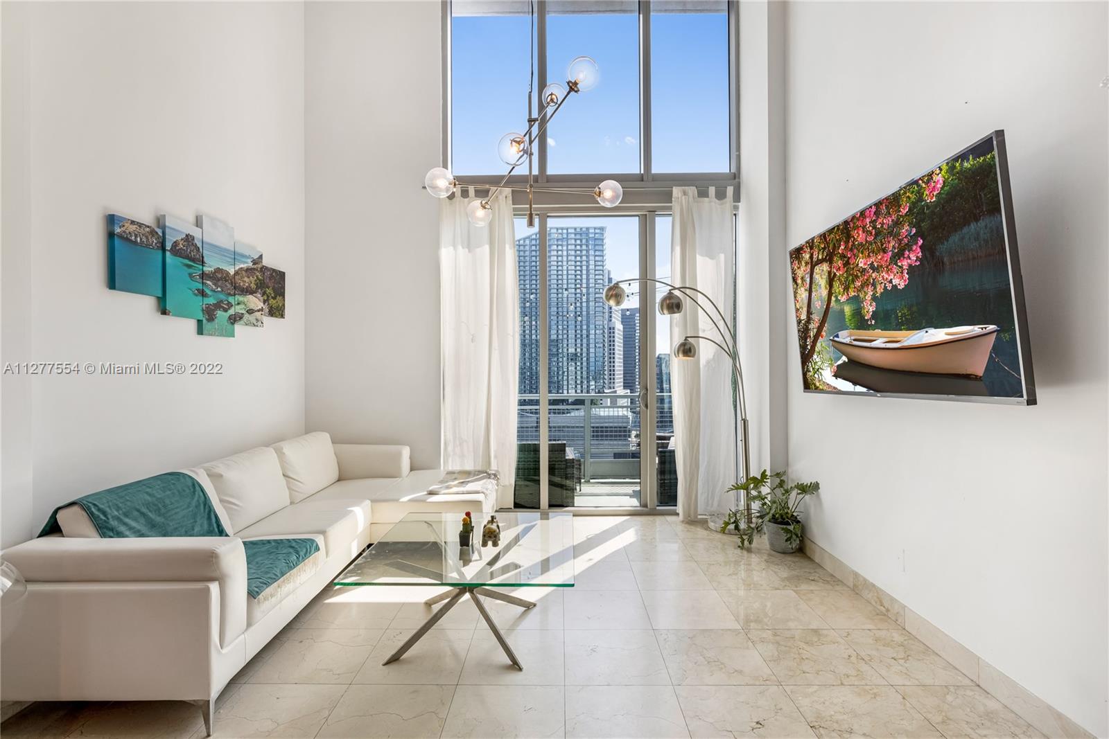 Spectacular 2 BR/2.5 BTH 2 story loft in Neo Vertika! Very spacious with loft style in Brickell - open layout residence featuring marble style tiles on the first floor and wood-like laminate on the second floor, granite countertop and SS appliances, high ceilings, double volume windows, and spectacular views of the river and city through two balconies. This building has impeccable management, amazing amenities including pool, lounge area, 1 gym, 1 dojo, 1 cross fit space, party room, management on site, 24 hr security, attended lobby and valet parking. Location is amazing, two blocks from Brickell City Center. Easy access to freeways, close to everything! One of a kind property that will not last! Very easy to show. Owner motivated, bring all offers!!