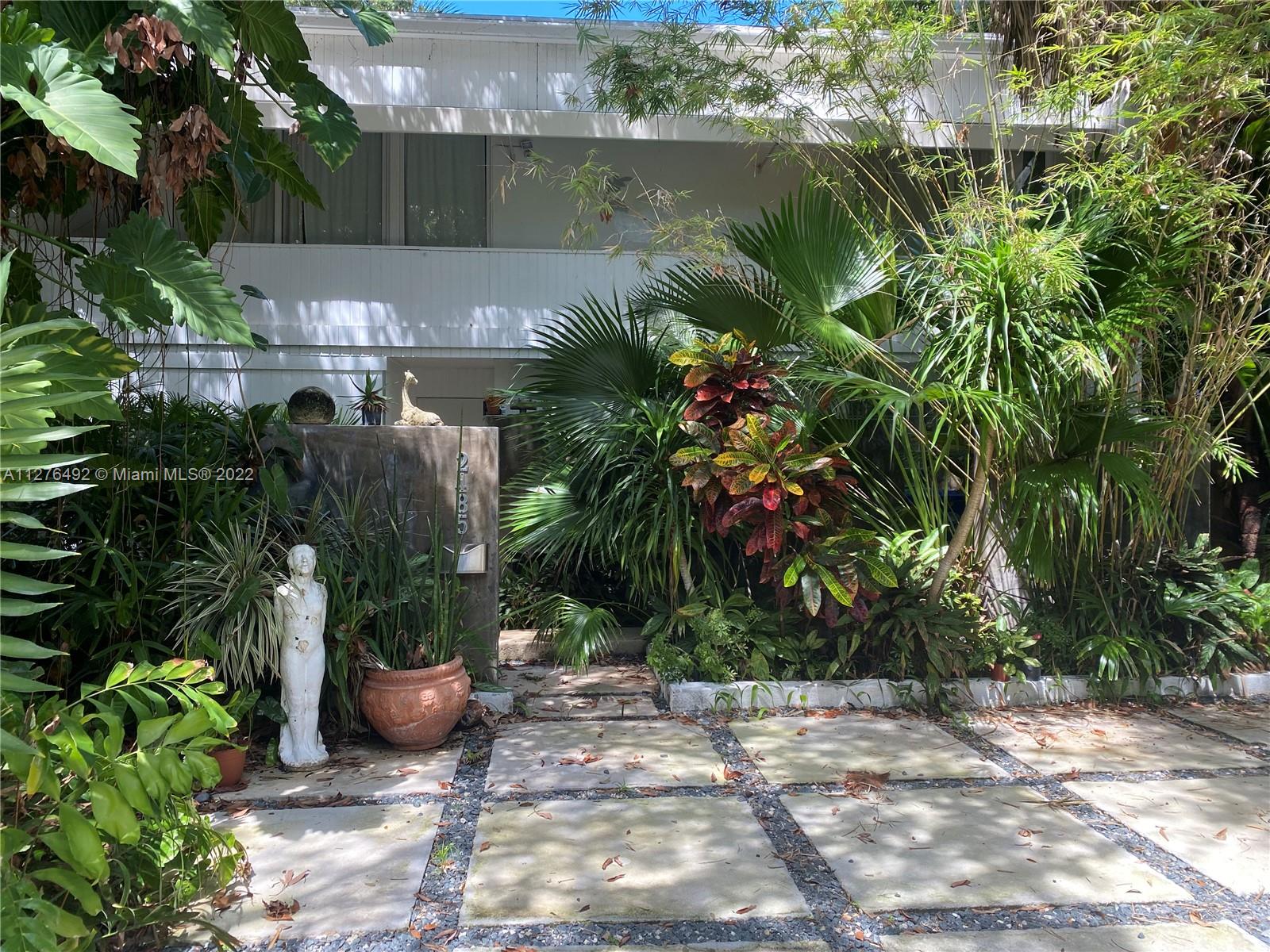Located in North Grove, close to the Village of Coconut Grove with shopping and good restaurants, a short compute to downtown, This beautiful 3 bedroom and 3 and 1/2 bath home is a must see. Floor to ceiling windows in the living room provide a beautiful view to a garden and  pool, providing privacy and serenity. One bedroom with bath is on the first floor. Also there is a Powder room.
Upstairs is 2 bedrooms with their own bathrooms.