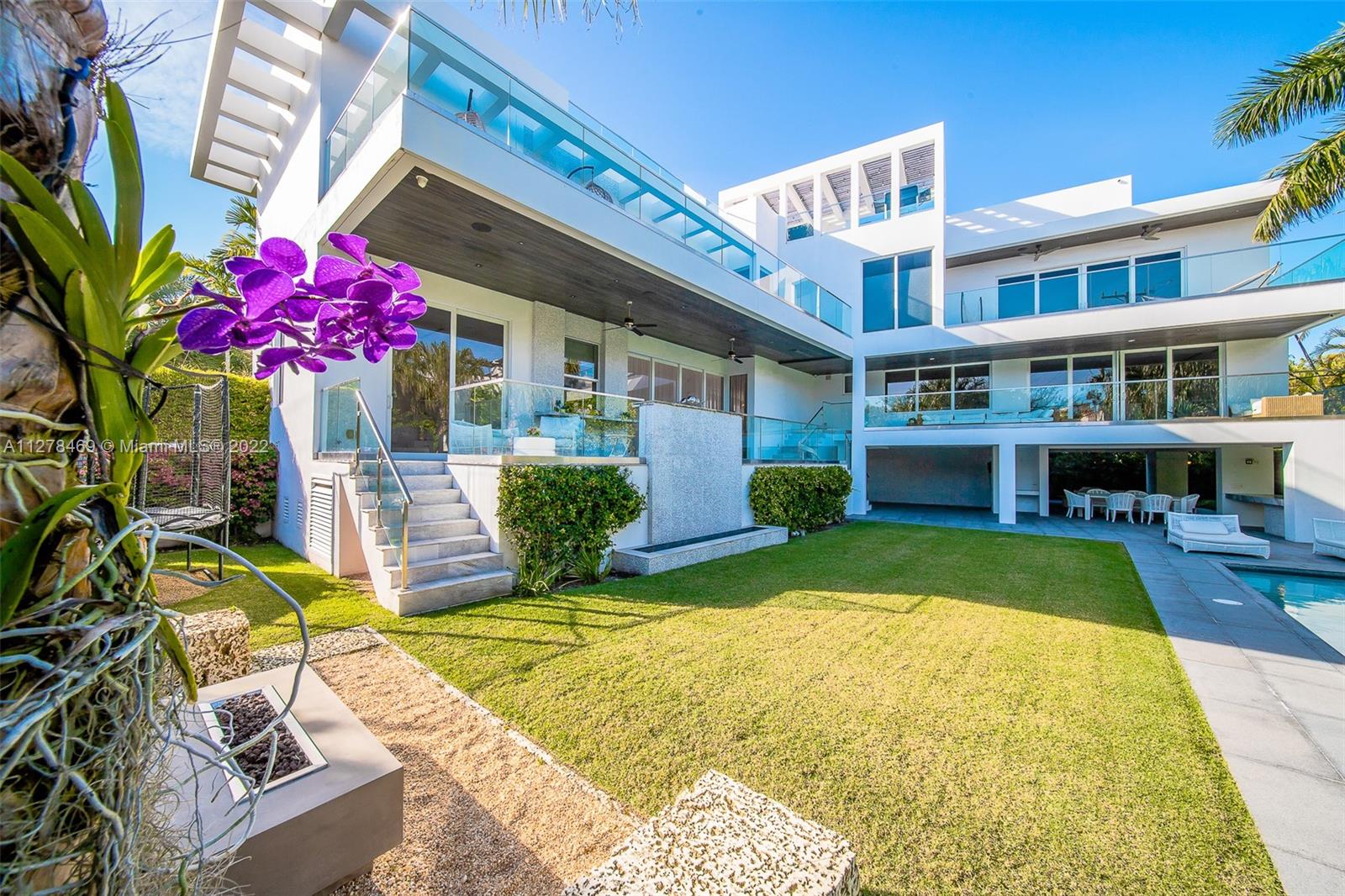 Custom built on a 10,480 SF corner lot. This home has been meticulously designed to accommodate a large family with generous spaces, ample terraces overlooking the saline, heated pool surrounded by manicured landscape. Covered terrace next to the pool ideal to entertain and a gathering fire pit area. Chef’s paradise gourmet Kitchen with Miele and Subzero appliances including 2 refrigerators & 2 freezers, 2 wall ovens, gas cooktop and Teppanyaki grill, wine cooler & built in coffee machine. Fabulous rooftop w/ powder room, jacuzzi for 6, sound system and the most amazing sunset views. Other features include 2 family rooms, an independent suite on main floor, wheelchair accesible. Master suite with enormous walk in closet and a Steam shower. Smart home w/ sound system & speakers throughout.