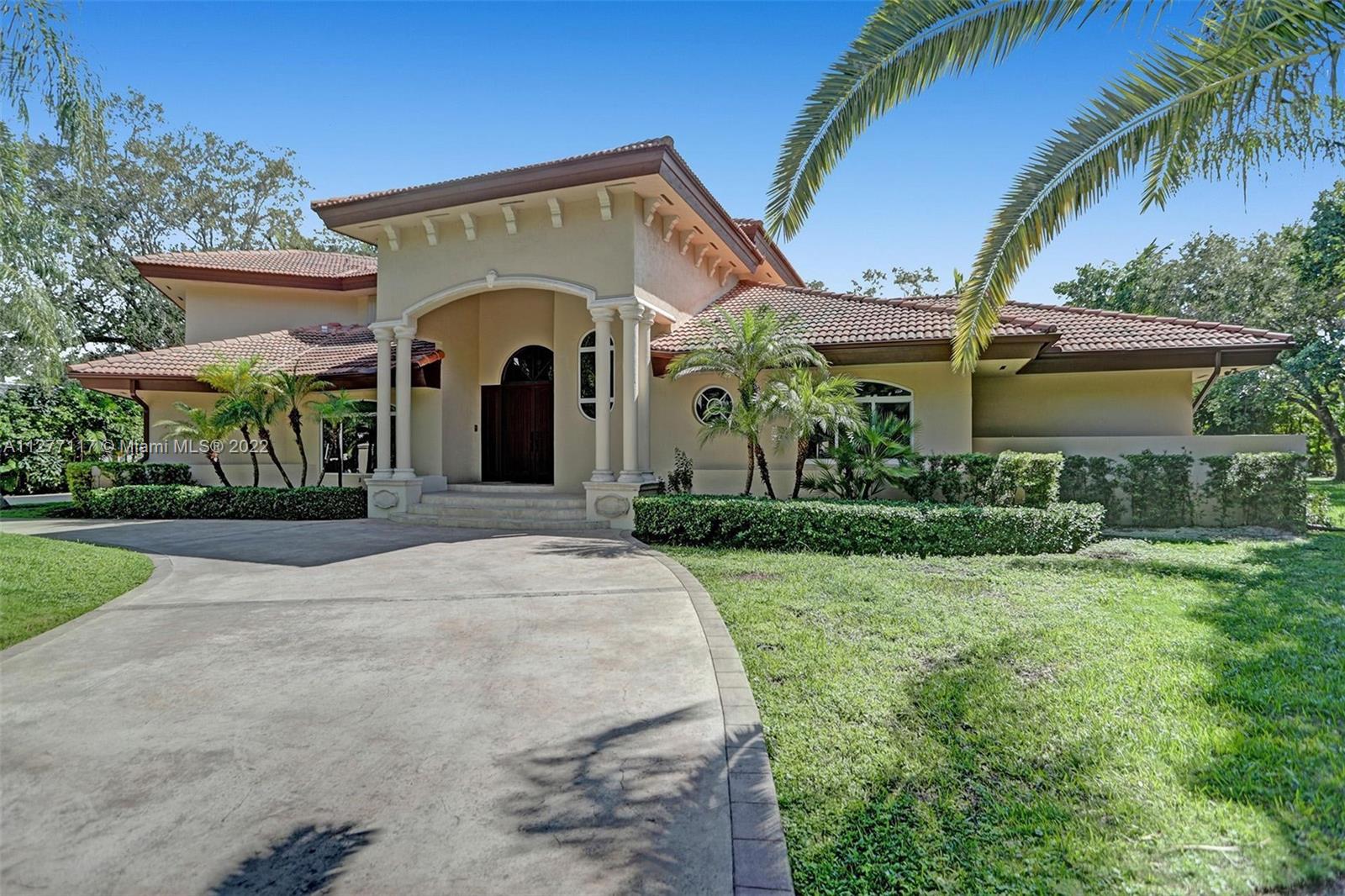 Welcome to this secluded split level home in prestigious N Pinecrest. 6BR, 5B 3 car garage on an almost acr lot! Spacious foyer leads to a dramatic 2-stry open living rm w/high vol ceilings & marble flrs. Ease along to the formal dining rm w/beautiful garden view. The gourmet kitchen features an island w/wood cabinetry, granite countertops, sub zero refrigerator/stainless appliances. The open concept breakfast nook flows into generously spaced-family rm w/pool view & tropical landscaped backyard. A lg primary suite sits on the 2nd flr w/walk-in closet & marble bath w/soaking tub. Walk on to covered terrace that overlooks the pool & tropical oasis below. There are additional 4/BR 3B on the 1st flr for family & guests. Property is walled-gated  for security and privacy.