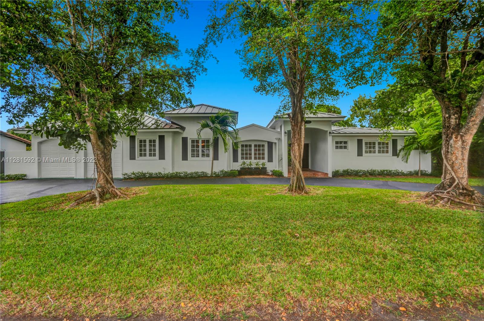 Drive down the tree-lined street in a prime section of Pinecrest to this beautiful home. This home has a wonderful floor plan with the kitchen open to the large family room.  The family room has high, vaulted ceilings. There are lovely architectural details in the interior.   The backyard is very private and features a large patio and a large, covered area that would be perfect for an outdoor kitchen.  There is a sparkling pool and room to park a boat.