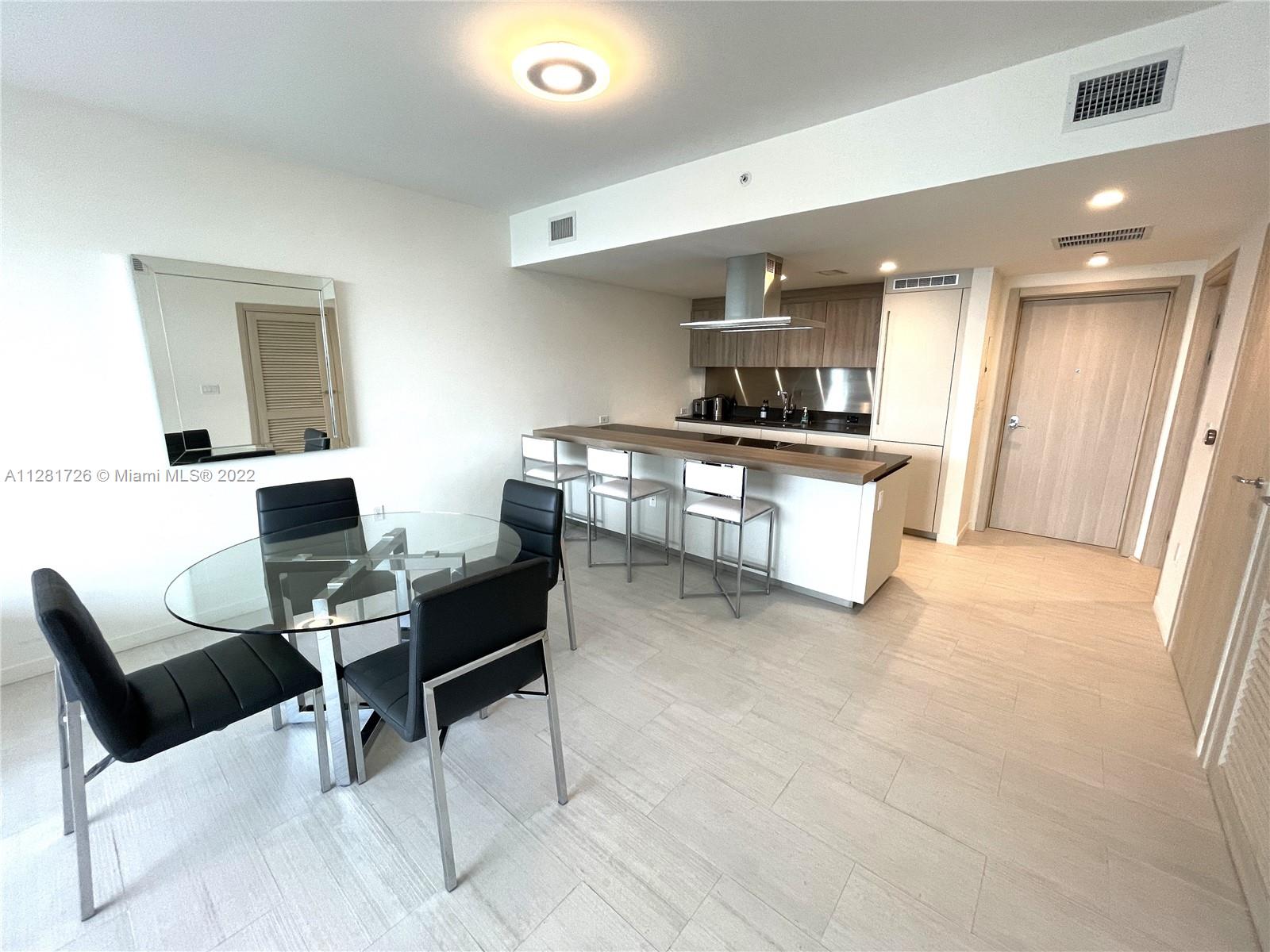 Luxury city living at its best! Fully furnished - possible 6 month lease term. This luxury condominium in Brickell rises 64 stories, enjoy beautiful Miami sunsets with unobstructed west views from floor-to-ceiling glass doors in this unit. Kitchen with fine cabinetry, porcelain floor, marble bathroom and closet with custom built-ins.  The building offers a roof top pool in the 64th floor, a rooftop spa with complete massage rooms and a high performance fitness studio and gym.  Children playroom and pool, a lap pool, private movie theater, a wine room and cellar, a social lounge, a billiard room.  Full time doorman and concierge.  Complimentary valet parking.