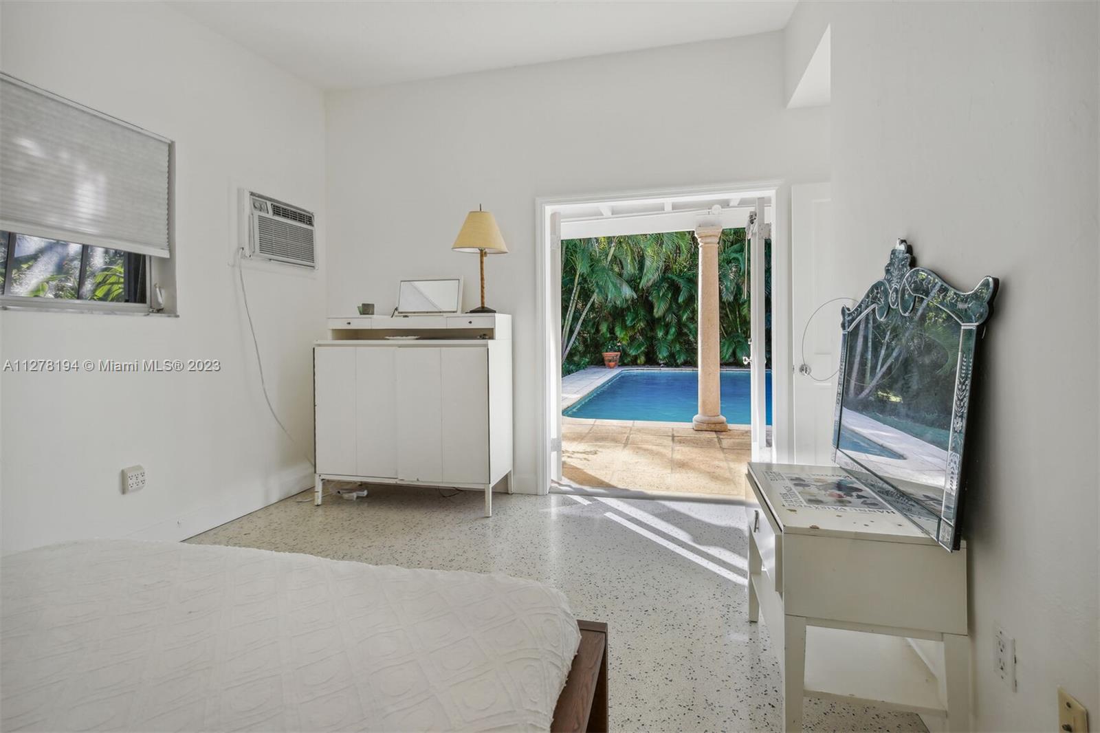 Overlooking Pool and Palm Trees.