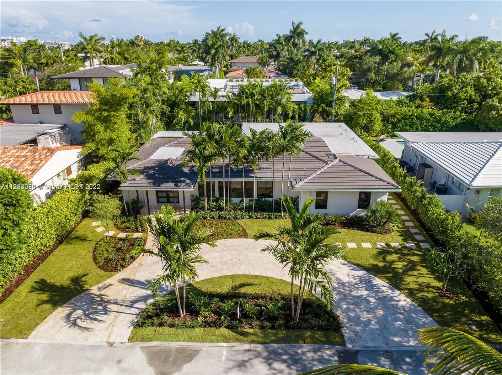 Fine design meets resort luxury with this beautifully redesigned Bay Harbor Islands home. Completed in July 2022, it features 4 bedrooms + a den and 4.5 bathrooms on an oversized 10,938 ft.² lot. The fabulous floorplan connects the generous living room, sun-filled dining room, and high-end open kitchen with rich wood cabinetry, quartzite stone countertops, and Wolf & Dacor appliances, including an oversized gas stove. Relax, refresh, and entertain in style with a new patio and saltwater pool surrounded by lush palms. The home has high-impact windows & doors, new plumbing & electric, gas water heater & dryer, and a control 4 smart home system. Living area is 3,324 Sq.Ft