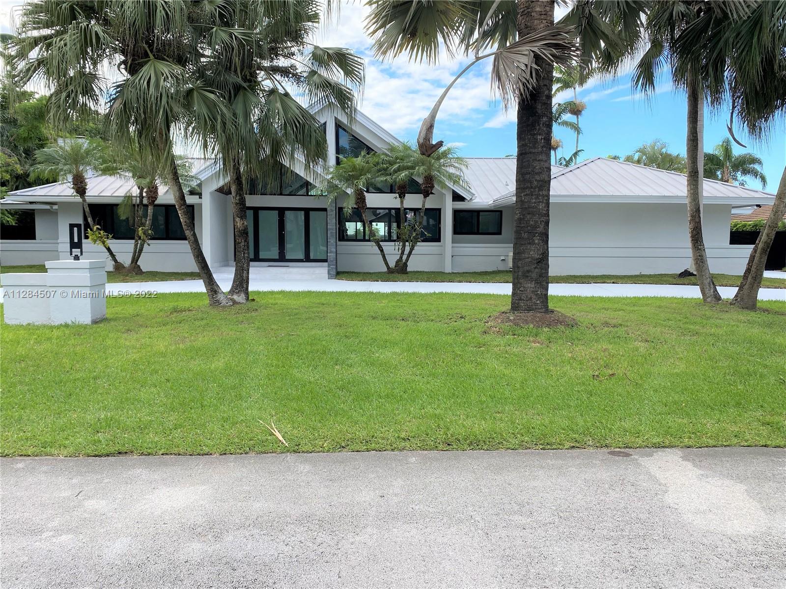Be the first to see this gem, exquisitely renovated with remarkably fine details, no expense spared using only the finest and more expensive materials, huge 5 bedroom three and a half bath with 4,600 SF actual area set on a 16,999 SF. Cul d Sac lot in highly desirable location in Pinecrest, featuring soaring ceilings and windows - Open Light and bright, perfect Split Plan, immense Open Eat-in Kitchen that flows out to the beautiful open HEATED POOL and a Tranquil Tropical patio surrounded by a tremendous yard area perfect for entertainment, central vacuum, 2 car garage, completely fenced and gated, beautiful metal roof, impact doors and windows and much much more to mention here, ready to move right in, Come see it, you will fall in LOVE