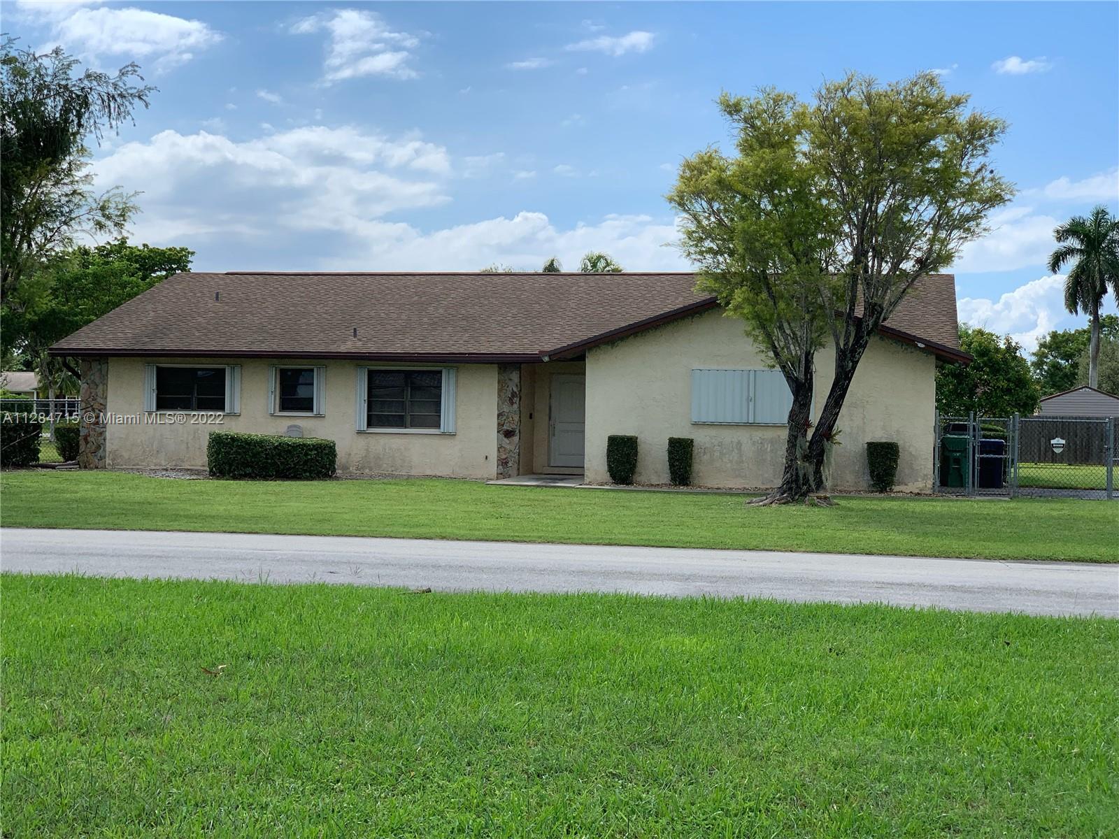 Fantastic Opportunity To Own! 3 bedroom/ 2 bathroom/ 2 car garage on 20,720 Sq.Ft over sized corner lot. With plenty of space to add a pool and space for a boat/camper.  Property features tile throughout except for the guest rooms, which have carpet. Master bedroom has a bonus office/sitting area. Wood Kitchen cabinets. 2019 roof, 2018 A/C unit outside & 2021 inside unit, 2021 water softener. Hurricane shutters (accordion) for all windows and sliding glass doors. Hurricane entry door. Property is located near Park, High School and Elementary/Middle School.