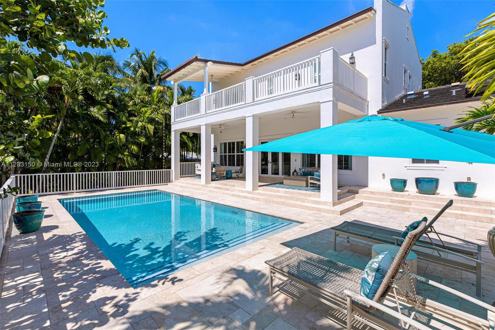 BAHAMA-CHIC TROPICAL OASIS PROFESSIONALLY DESIGNED IN SUNRISE POINT! This Impeccably Renovated Gem Features 4 En-Suite Bedrooms, En-Suite Service Quarters, Formal Living Areas + Family Room in a Warm Contemporary-Colonial Style. Kitchen w/ Sub-Zero & Wolf Appliances, Custom Kitchen Cabinetry, Ample Cooking Island + Cubic Gold Mosaic Backsplash w/ Touches of Matte Gold. Cream Marble + Brazilian Floors t/o w/ Soaring 12’ Ceilings. White Lacquered Plantation Shutters frame Impact Glass Windows while Whimsical Deep Porches Adorn the Exterior. Bask in the Florida Sunshine along the Pool Deck Straight Out of a Boutique Resort. Surrounded by Top Schools, Walking Distance to Parks + 8 Miles from the Airport.