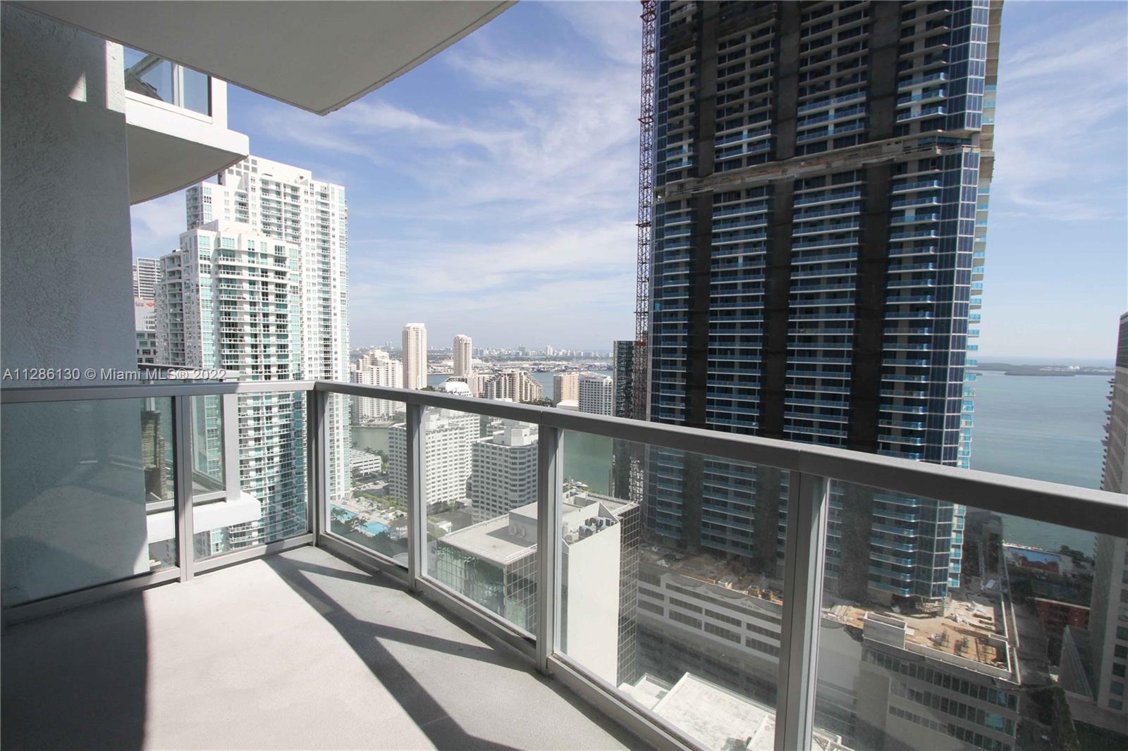 Live in the heart of Miami! If location is what you want, this is your place! Spectacular 963 sq ft space on 34th floor overlooking Brickell Avenue, Biscayne Bay and the Port of Miami. Huge balcony. Washer/dryer in unit. Fantastic pool deck overlooking the city located on the 12 floor. Spa/sauna/showers; billiard, cigar, wine, virtual golf rooms. Yoga, cardio & weight rooms. 1 assigned parking space plus valet. Pet friendly up to 25 lbs for 1 dog, 50 lbs. for 2. VERY WALKABLE NEIGHBORHOOD, WalkScore is 99. Transit Score is 96. Walk to MetroMover (< 1 blk), dining, cafes, bistros and entertainment. Take MetroMover/MetroRail to: University of Miami, Brickell City Center, Hospital District, Arts and Entertainment District, Civic center, Miami International Airport, TriRail Service and more.