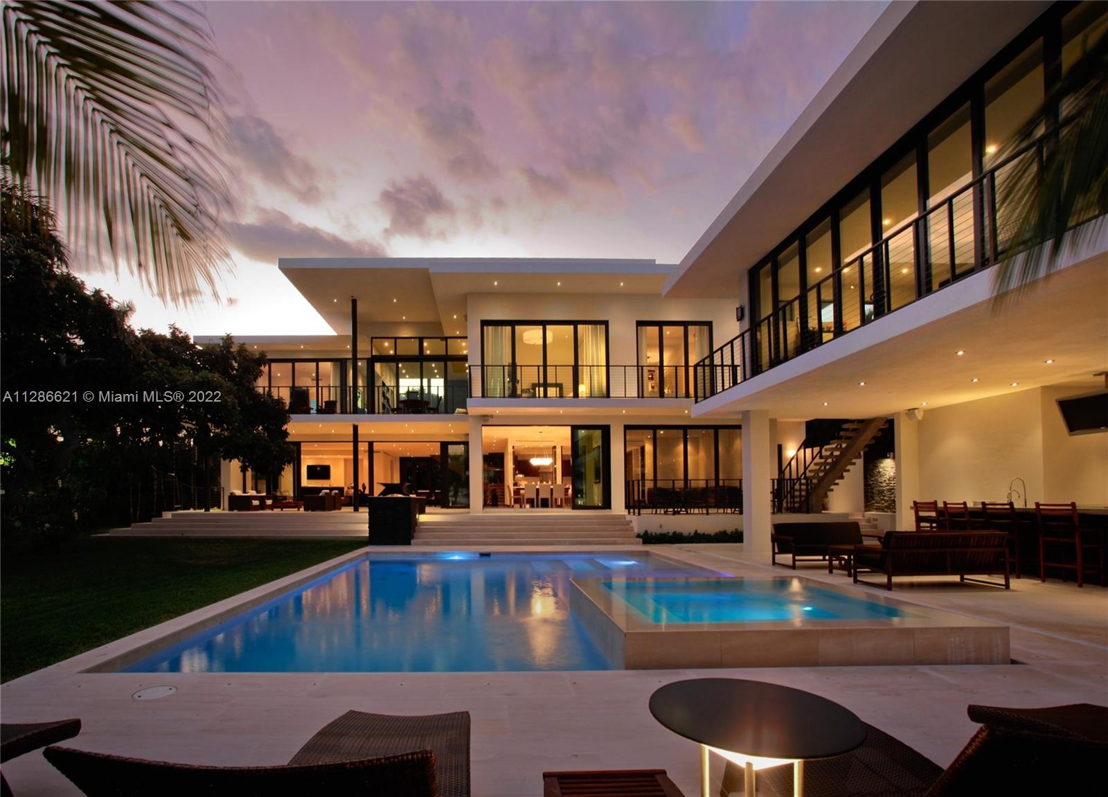 Largest Tropical Modern home on largest wide-bay (double) lot available on the Venetian Islands offers movie-set glamour on a half-acre waterfront stage.The Ralph Choeff-designed resort-style residence commands dramatic South Beach vistas along 120 waterfront feet. Featured in Florida Design Magazine, the stunning 9,000sf house on a 21,000sf lot boasts poured concrete construction, impact glass doors/walls, limestone floors, balconies & terraces. Grand Master w/His & Hers baths/walk-ins. Gourmet kitchen, upstairs family & home office. Southeast breezes make for idyllic indoor/outdoor living w/pool, spa, cabana/guest house, summer kitchen/lounge, generator, dockage for 3 boats +2 lifts, no bridges to bay.Walk to Sunset Harbor/Lincoln Rd, bike to Ocean Drive, 10min drive to Downtown/Brickell