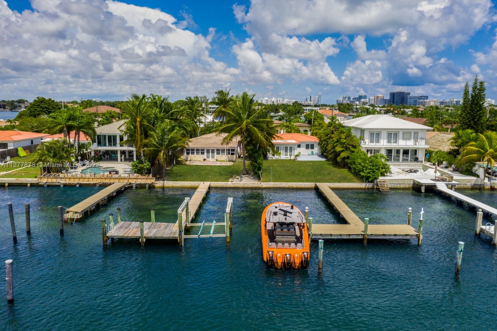 Incredible waterfront opportunity in the exclusive gated community of Stillwater in the heart of Miami Beach. Live in this perfect condition charming home while you design your dream home or renovation. Features include a 50FT dock for yacht enthusiast, wide open waterfront views overlooking Downtown Miami and the intercoastal waterway, two oversized bedrooms, 1 car garage and circular driveway for an additional 4 cars. Adjacent Lot is available for sale for a dream land opportunity that would be a total of 16.000 SF and 100 FT of water frontage making it the second largest piece of land in the island. Call Listing Agent for showings.
