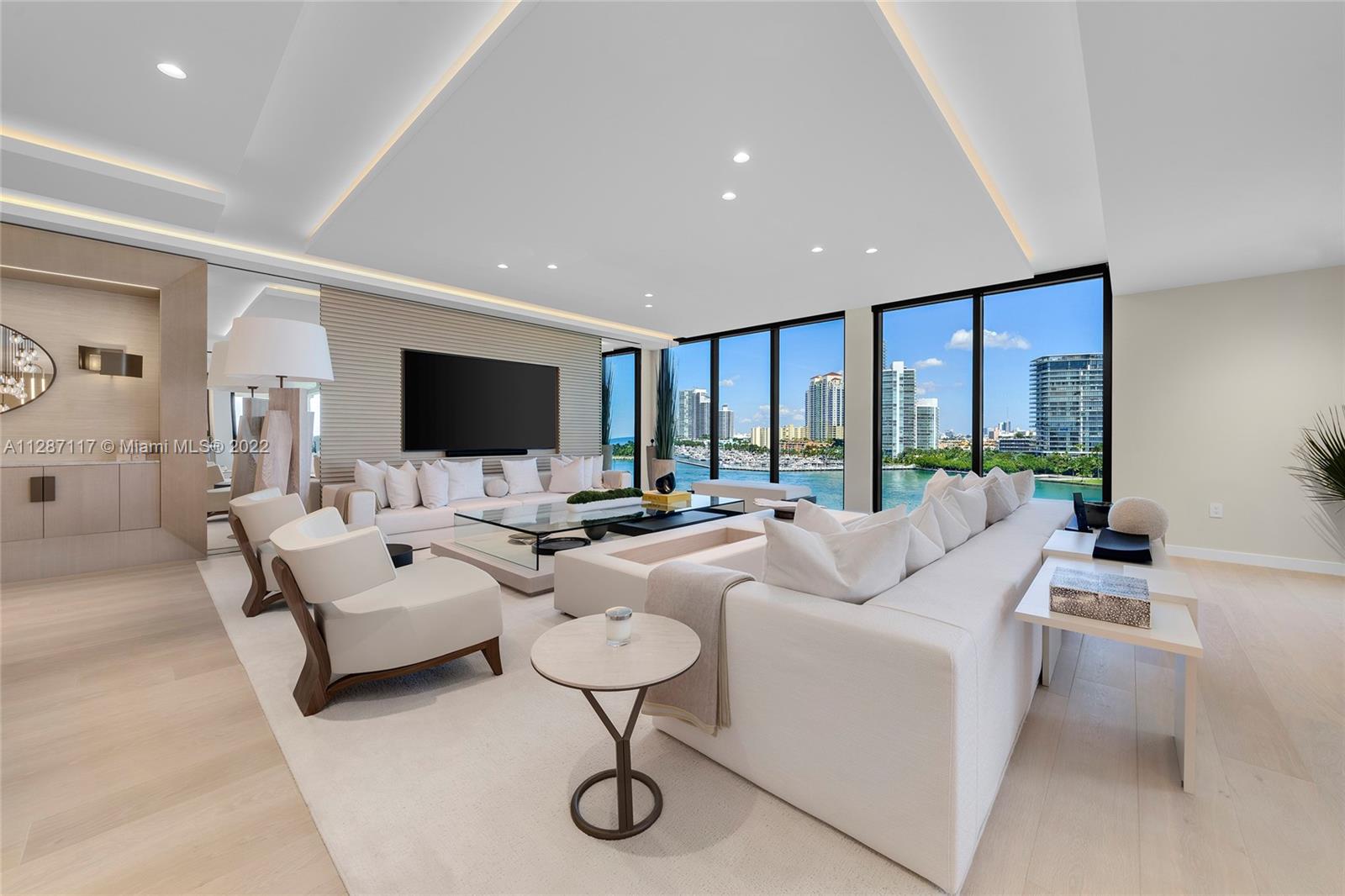This stunning custom designed Northeast corner unit at Palazzo Della Luna is being offered furnished. This perfectly proportioned unit offers 4,904 SF w/wide plank oak wood floors, custom millwork, lighting & wall treatments throughout, plus a large wraparound terrace with direct Biscayne Bay, Government Cut, Miami Beach & Ocean views. Spacious flow through living & dining room, & separate media area. Boffi designed chef’s kitchen & top-of-the-line Miele & Sub-Zero appliances. The private principal suite has a sitting area, dual walk-in closets, direct water views, amazing bathroom w/book-matched Carrara marble rain shower & soaking tub. 2nd private back terrace w/views to Fisher Island & 3 other bedrooms w/en-suite bathrooms. Enjoy 6-star Palazzo amenities plus all Fisher amenities.