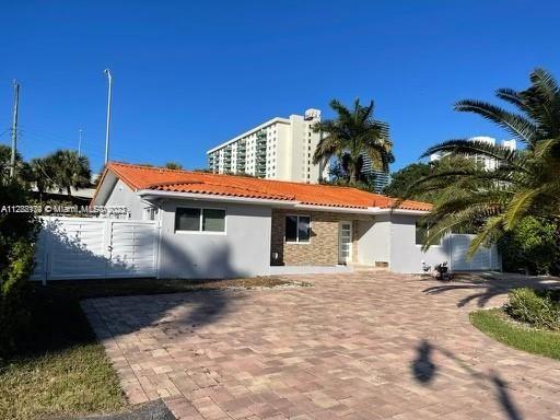 MOTIVATED SELLER...PRICE DRASTICALY REDUCED !!! GREAT OPORTUNITY !!! Completely Updated With No Expense Spared. True modern luxury living in this 4/3 2670+ Sq. Ft. home located across the street from the Ocean in Sunny Isles Beach. Offering endless comfort, enjoyment, and privacy with a brand new fence surrounding the property. An entertainer's dream home. Features a huge covered patio, outdoor kitchen, gate for boat, mosquito sprayers, new shed & A/C doghouse. Interior equipped fully renovated from top to bottom including kitchen and bathrooms. Open spacious floor plan with marble floors. Impact windows & doors. Minutes from Aventura Mall & High-end restaurants.