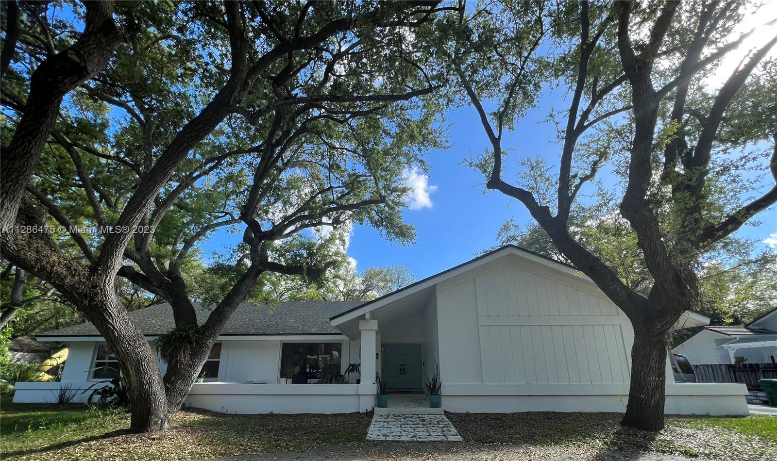 The best that Palmetto Bay has to offer! Won't last, this gorgeous 4/2/1 Modern Ranch beauty is located on a quiet Oak tree laden street off of Old Cutler Rd, blocks from Deering Estate and People's dock. Recently updated features include: New Roof (2022) High Impact Windows & Slider Doors (2020). Front Porch is sizable and welcoming with picture window for added curb appeal. Volume and Vaulted ceilings are located throughout the home & master bedroom suite. The heart of the home, the kitchen is voluminous with large galley pantry, dual wall ovens and x-large bay window with pool view. Working fireplace in Family Room. Available RV or boat parking on either side of home, Black Point Marina w/in 8 miles. Large backyard equipped with custom Treehouse, shed, and playground area.