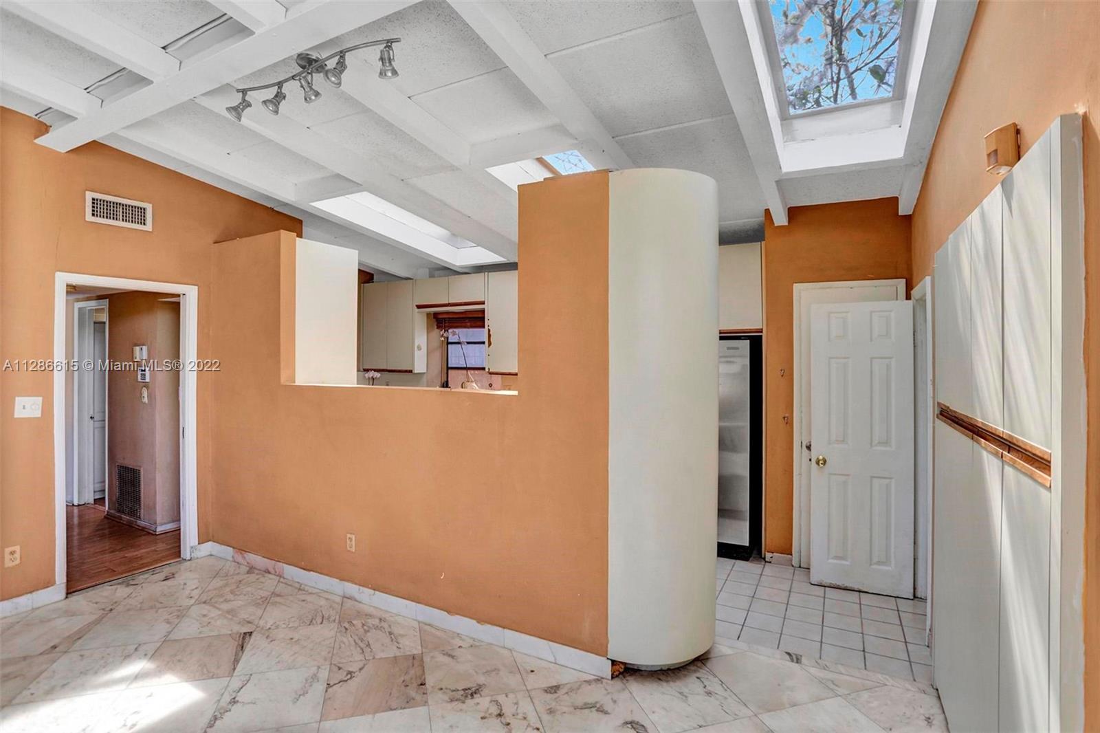 Entry to kitchen - notice the 3 skylights inside kitchen area..