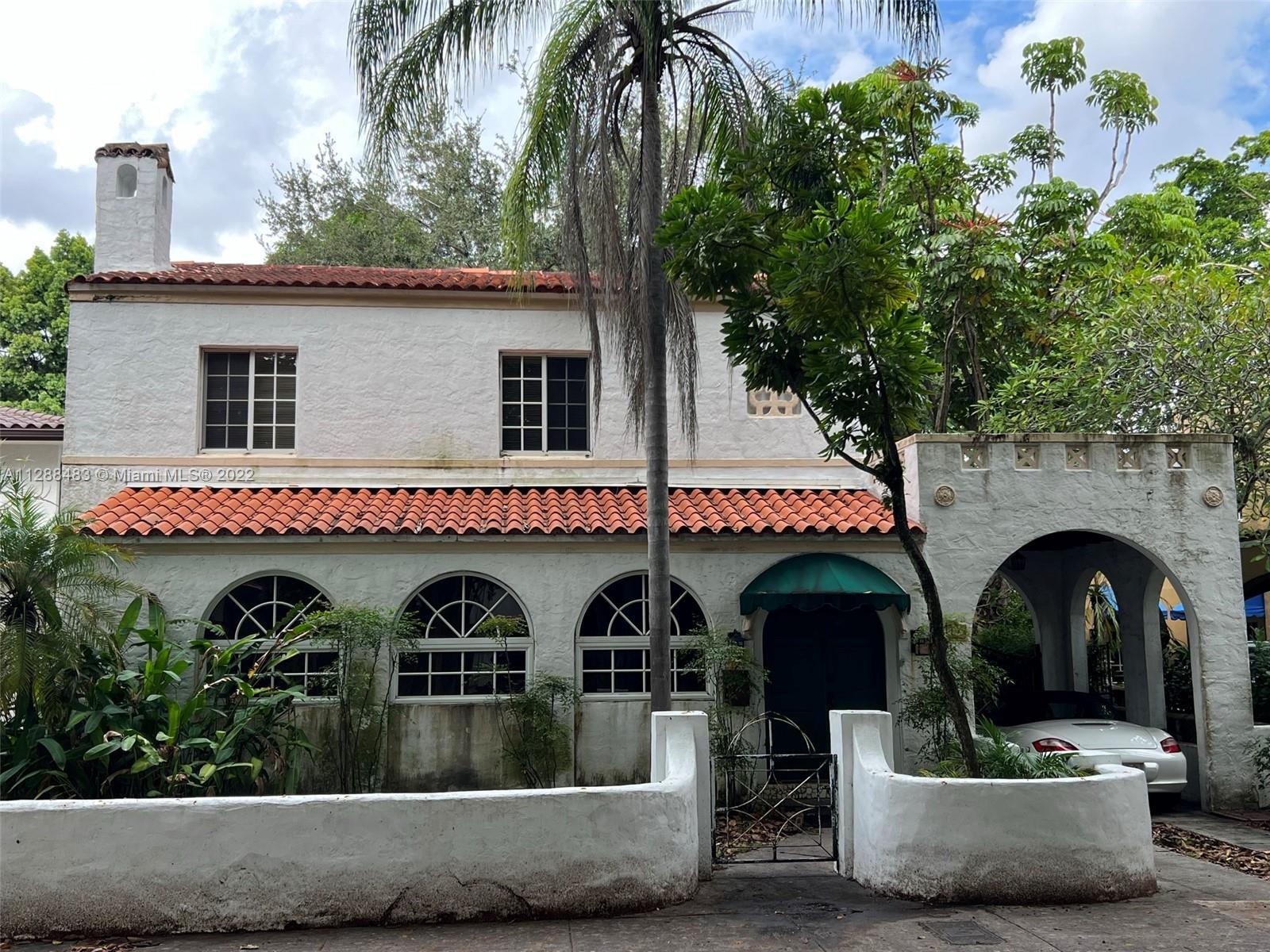 Charming Coral Gables Spanish Colonial Architecture home in a very sought-after Alhambra neighborhood, a short walk to Downtown Coral Gables. The first floor of the main house features terracotta tile with Single Hung windows. It has a long foyer, Living Room, Den, Dining Room, Kitchen, and Powder room. The kitchen features Granite counters and tile backsplash with custom wood cabinetry.