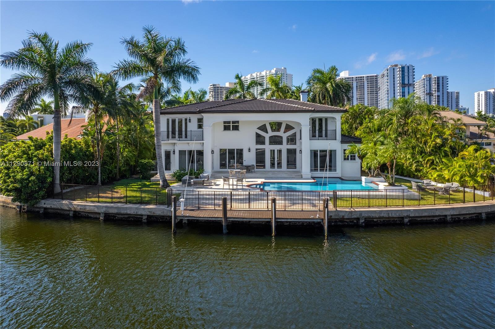 Welcome to one of the most special estates within the exclusive Golden Beach. On a culdesac, upon 125 ft of private quiet waters, a turnkey Mediterranean mansion awaits you. Greeted by a private property gate, 455 Center is tucked nicely behind beautiful landscaping, and welcomes you to an open and airy feeling home. High ceilings, an open floor plan, well designed connecting large rooms, every bedroom facing the water, and a ground level master bedroom make this one a dream come true. Walking distance to the neighborhoods private beach, parks, tennis and basketball courts. Offered fully furnished, and ready to be home.