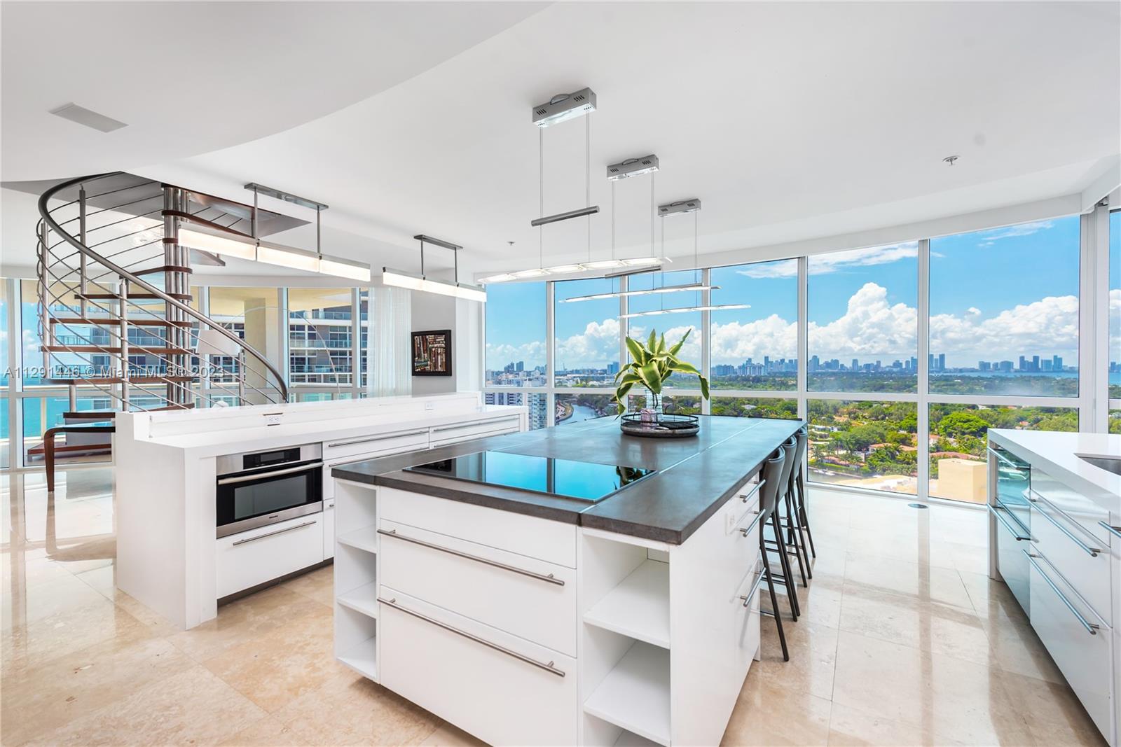 Impeccable corner 4-bedroom, 4-bathroom rare penthouse gem at the Mosaic in Miami Beach. This large furnished unit boasts a split floor plan with a den/family room. Watch the sunrise and sunset from your private rooftop and 4 balconies, featuring stunning ocean, intracoastal and city views. The rooftop terrace is very spacious for entertaining and overlooks the beach. A private foyer entrance leads to an open living space with an abundance of natural light. The Mosaic offers wonderful amenities- a heated pool, beach service, gym, theater room, party room/lounge, complimentary valet, and front desk concierge. Come explore this exceptional penthouse!