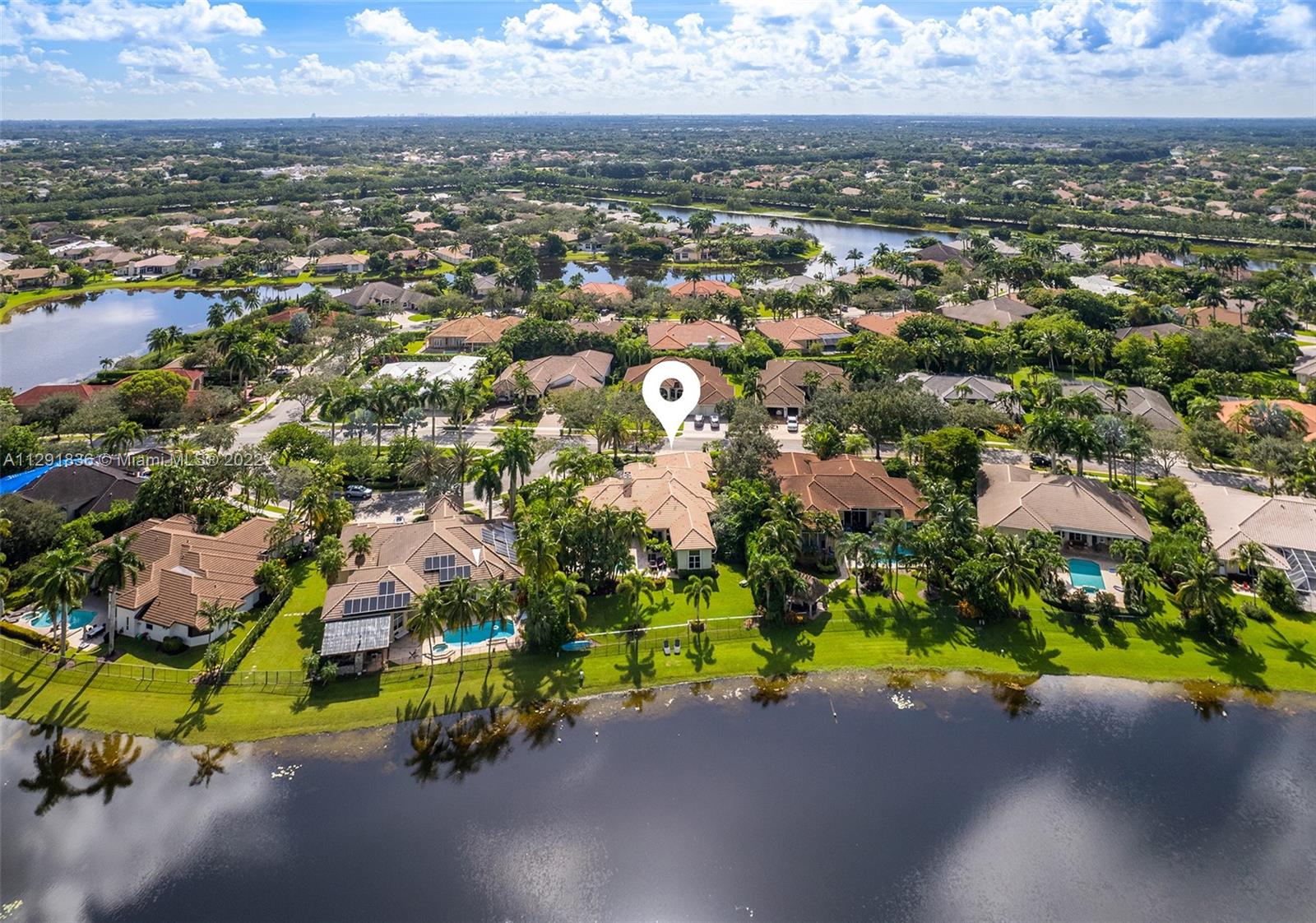 Exceptional Corner Waterfront Property located in the coveted community of The Landings in Weston. Impressive 23,174 sq.ft. lot the property offers sweeping water views. Recently remodeled the living spaces seamlessly connect to the thoughtfully conceived lush outdoor areas including the covered terrace and heated saltwater pool/spa with plenty of space for lounging in the sun. All-new systems (A/C’s, pool heater, appliances) and substantial upgrades ensure the home is comfortable year-round.  The home features 4BR/4.5BA+Custom Office/Library, Large Den, Formal Dining room & 3-car garage. Entertainer’s kitchen, volume coffered ceilings, wet bar, wood burning fireplace and light filled interior are among the many modern conveniences to be enjoyed and perfect for the discerning Buyer.