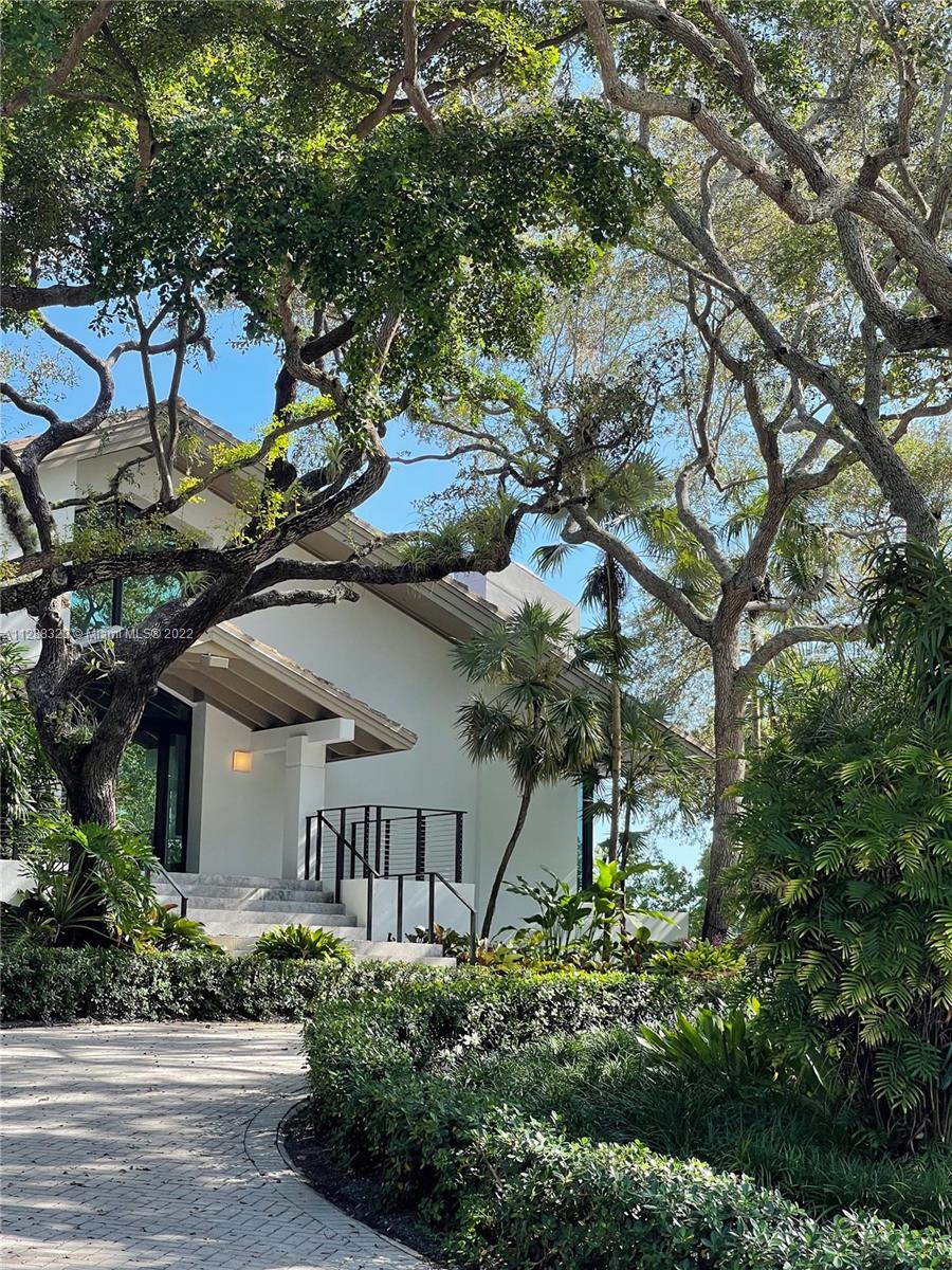 Ideally located in the esteemed gated community of Hammock Oaks, side by side with 1000 acres of protected land, this spectacular waterfront home is the epitome of Coral Gables living. Upon entering the grand foyer you are greeted by floor to ceiling windows showcasing water views & an abundance of natural light. Upstairs primary suite provides glorious views spanning Biscayne Bay to Downtown Miami. Whether entertaining in the spacious great room or outside by the pool, relaxing in the terrace or hopping into your boat, conveniently parked on your private 70ft dock, this house will be your own private enclave. Enjoy the magic of this tranquil setting while still being minutes away from some of the best private schools & restaurants Miami has to offer. Also available for lease #  A11320948
