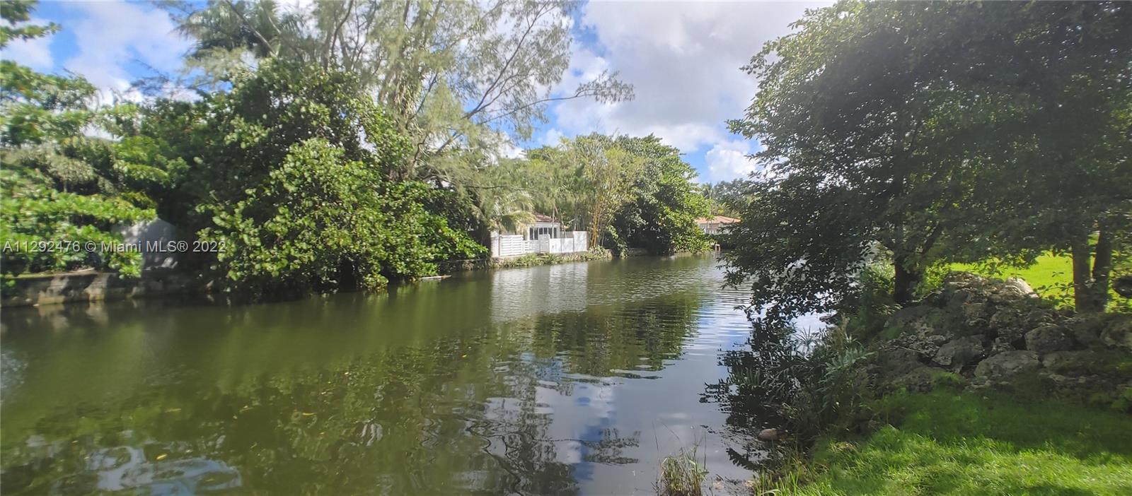 9-view from across canal - property on left before white house