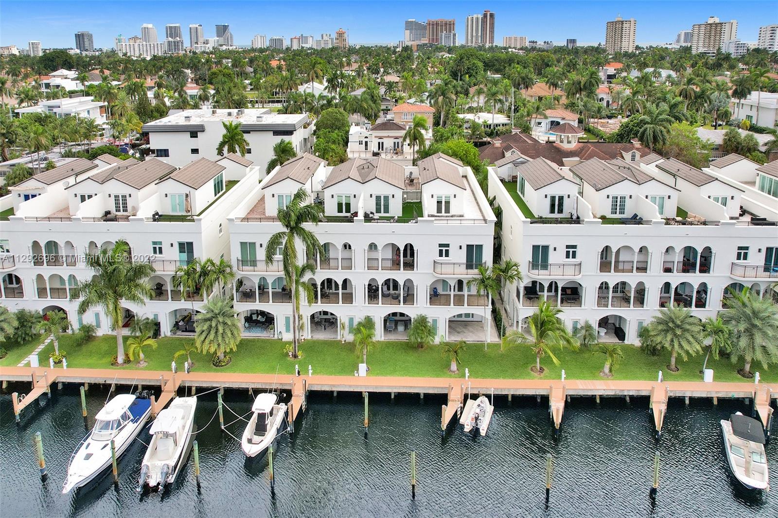 WATERFRONT, FEE SIMPLE TOWNHOUSE. 3763 SF, PRIVATE DOCK! Enjoy the Las Olas lifestyle in this spacious townhouse with a deeded dock for up to a 52' boat. Gourmet kitchen, high end appliances, wall oven, rooftop terrace, two car garage, loft and den. Enjoy amazing waterfront views from two balconies. Large master bedroom with walk in closets and enormous master bathroom with dual sinks, and separate tub and shower. High ceilings, impact windows and doors, marble and wood floors through out, private gated driveway, two laundry facilities and elevator. Extensive exterior upgrades have just been completed. This home has everything for a price that cannot be matched on the Las Olas Isles. Minutes to Intracoastal waterway, las olas, the beach, airport, and mall.