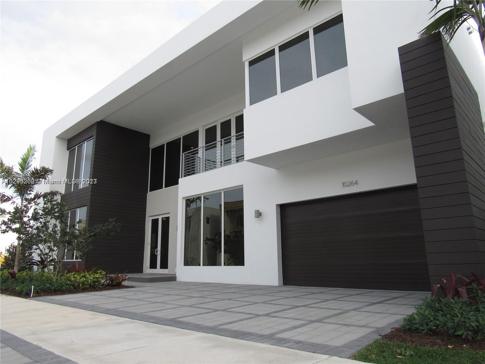 MODERN 75" LAKE FRONT & POOL, 5 BEDROOMS/ 5.5 BATHROOMS OVER $185,000 IN UPGRADES, BEST LOCATION, 24' CEILING, 2 CAR GARAGE WITH STORAGE CABINETS,  ITALIAN WOOD CABINETRY, CABLE WIRING FOR AUTOMATIC WINDOWS SHADES IN ALL BEDROOMS TO CONTROL A.C AND LIGHTS, BUILD-IT BBQ AREA, GARAGE W/ STORAGE CABINETS, A.C WITH ULTRA-AIRE (DEHUMIDIFIER) CUSTOM ITALIAN WALKING-CLOSETS, IMPACT HURRICANE WINDOWS, STAIRS WITH GLASS HANDRAILS, FULLY EQUIPPED FITNESS CENTER AND CHILDREN'S PLAYROOM, BUSINESS CENTER WITH MEDIA ROOM AND KITCHENETTE, SPA, SUN-DECK. IMPRESSIVE COMMUNITY AT DORAL WITH UNIQUE MODERN DESIGN