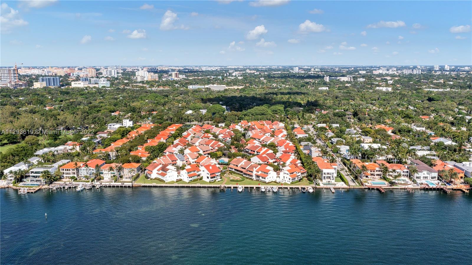 Beautifully kept tri-level villa in the unique 24 hour guard gated community of l'Hermitage on Biscayne Bay with it's own private ground floor patio! Fantastic layout with volume ceilings! Spacious eat-in kitchen with plenty of storage, open concept living/dining room with a beautiful large screened terrace for alfresco living, dining and entertaining. The master bedroom suite is huge with a large walk-in closet and its master bathroom. Brand new appliances and A/C's. New roof. In-laws quarters on the ground floor. The community also has a dock of 15 boat spaces on one side (rent/own), 2 clay tennis counts, 2 car garage + carport for an additional 2 cars. Perfect location, opposite Ransom Everglades, steps from Kennedy Park, marinas, restaurants, shopping and 7mins drive from Brickell.