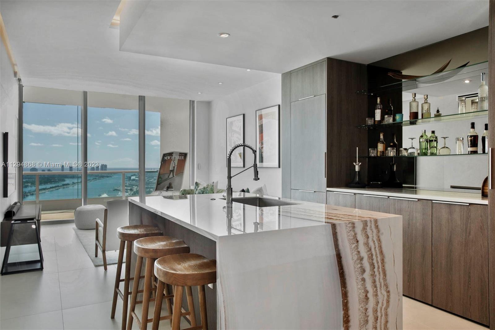 Brand NEW coveted 07 line in the prestigious 900 Biscayne! Fully upgraded and renovated 1 bed, 2 full baths + Den. Unobstructed view of the bay with one of the most spectacular views in all of Miami. Across the street from FTX Arena, Perez Museum, Frost museum. Porcelain floors, stainless steel appliances, a kitchen with stone countertops, 10” floor to ceiling impact glass windows, dual sinks in the master bedroom, Italian closets and custom millwork, and a large private balcony. The building features 2 pools, spa, private movie theater, 24 hour security, fitness center, wireless throughout, assigned parking space + valet, billiard room and much more.