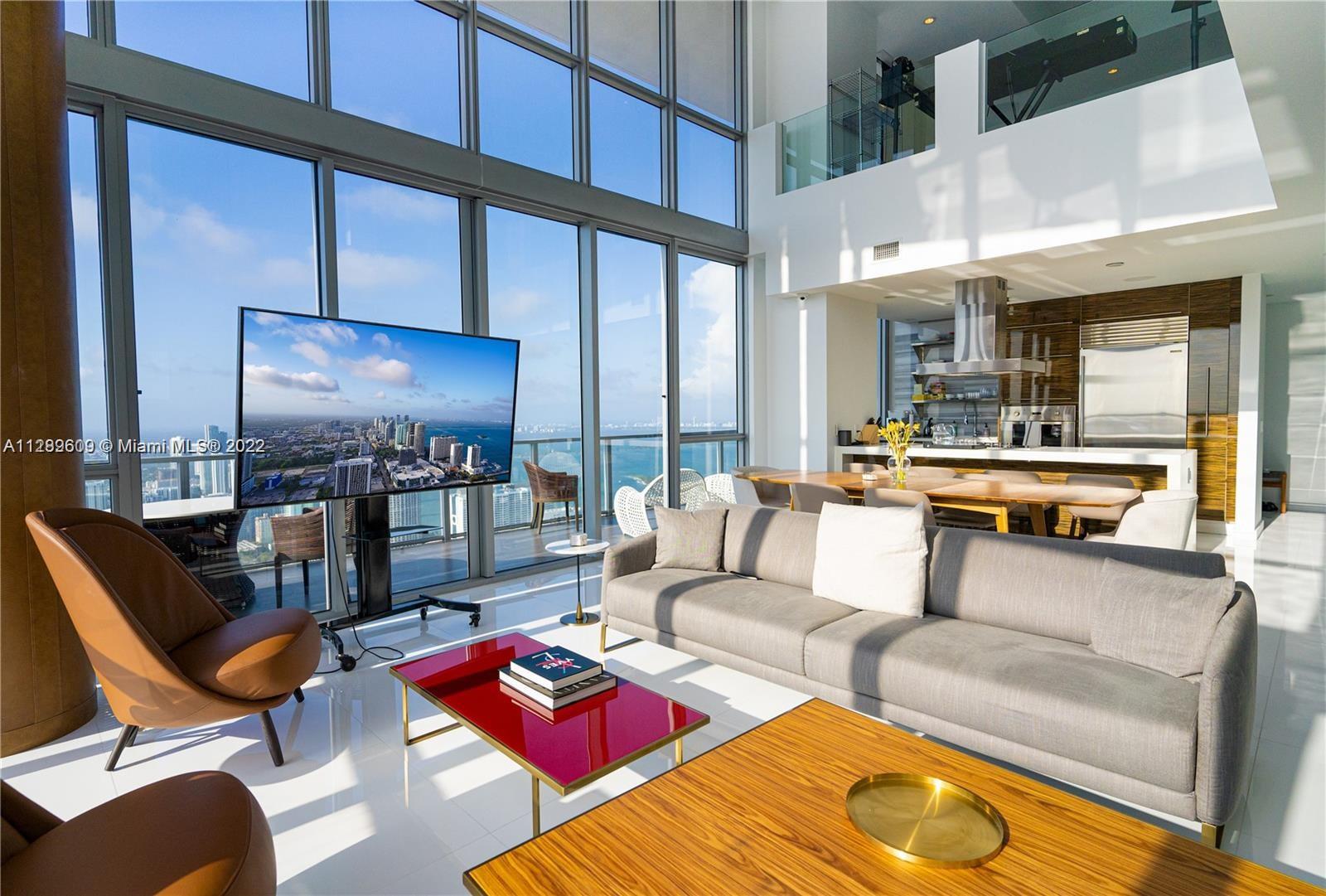 Soaring above downtown from the 63rd floor of the Marquis Miami Tower, this magnificent 2-story penthouse captures breathtaking 270° views of the city, ocean and Biscayne Bay. Two private elevators lead to the 2-bedroom, 2.5-bathroom residence with 20-foot ceilings and floor-to-ceiling windows. Over 3,000 sq ft of open-plan living space with select contemporary details, chef's kitchen with state-of-the-art stainless-steel appliances, second-floor media room, private terrace and Sonos surround sound system. Residents enjoy luxury amenities including 24-hour concierge, spa, restaurant, fitness center, 2 pools and the beach club at Bentley Club Hilton in South Beach. The Marquis is located moments from the Bayfront Park, American Airlines Arena, South Beach and Miami Worldcenter.