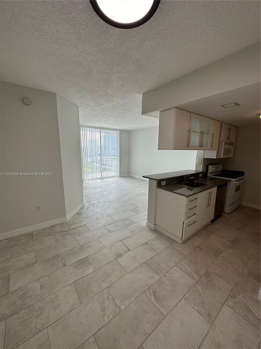 Beautiful condo 1 bedroom/1bath located at the corner of Biscayne Blvd and 18th St in the Edgewater/ Midtown Miami Arts District Arts District Area. New Italian Porcelain flooring installed throughout apartment.   Just painted with all new Baseboards, New Lighting throughout apartment.  Spectacular Condo in an amazing location.   Also - owner will replace refrigerator with new stainless steel refrigerator.  Conveniently located near all of the city's hot spots. Very close to shows and restaurants.  The actual building also has several restaurants on the first floor.  Minutes from South Beach, Miami Airport and Downtown.  Convenient to I-95.
