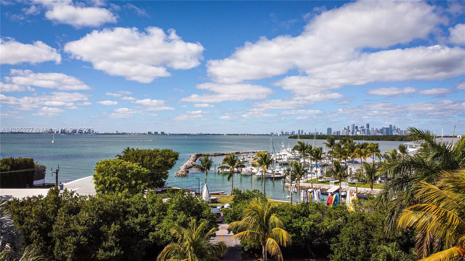 Located on exclusive & prestigious Harbor Dr. 1 of only 8 properties located directly facing Key Biscayne Yacht Club. 
Fully renovated: floors, baths, kitchen, brand new high impact doors & windows. 10 ft elevated. 
Upper level: High ceilings, spacious and ideal Living & Dining Area with spectacular views to KB Yacht Club & sunsets. OPEN VIEWS! Half bath. Master bedroom with walk in closet, bathroom with double sinks, shower & bathtub. Luminous kitchen with lots of storage space & dine in area. 5th Bedroom/Office.
Lower Level: 3 spacious & bright bedrooms. 3 renovated full bathrooms. Laundry room with direct access. Family room with access to the pool & barbeque area. 
Exterior: Covered terrace. With barbeque & bar area. Integrated pool & barbeque area on the same level.