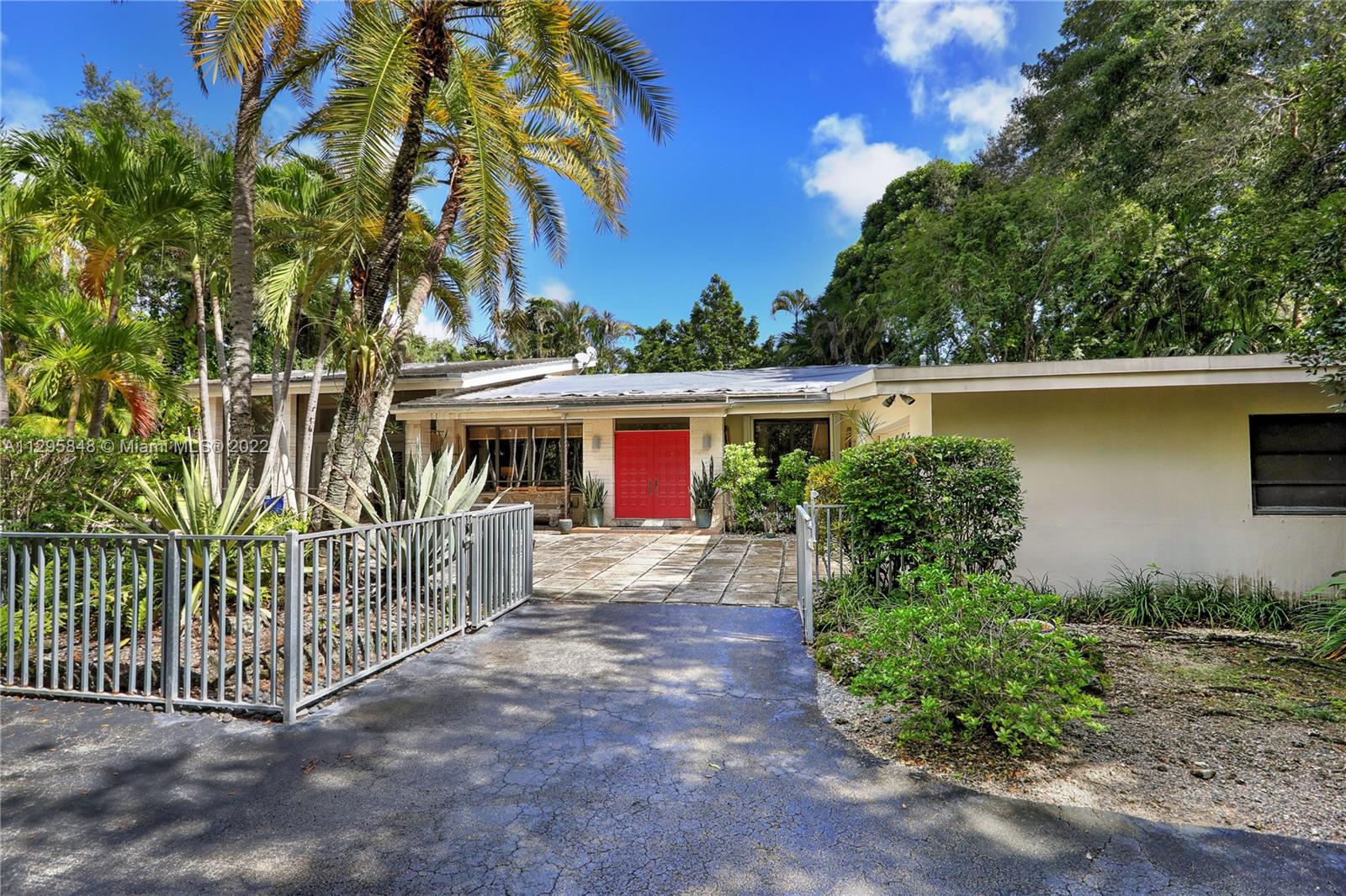Unique opportunity to restore existing home or build to suit in park-like setting on beautiful street in South Miami.  28,000+ sf of lush grounds with mature canopy.