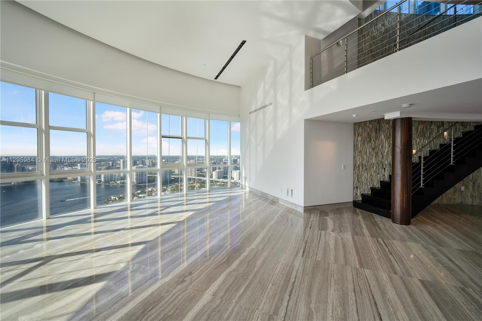Totally remodeled. This fantastic PH on the 55th floor has a living room with soaring 22-foot ceiling, a one of a kind & customized floor plan, and personalized luxe upgrades ready to accommodate designer taste. The space is two floors of 5,727 Sqft of interior living and 1,500 (more or less) Sqft of outdoor terrace, with a private pool and jacuzzi overlooking the ocean and city skyline. The 2 kitchen is state of the art from Poliform with Axor and Hansgrobe fixtures,marble countertops, and top-of-the-line appliances from Wolf & Subzero. All the washroom vanities are from Florence, and the wine cellar holds up to 500 bottles. The master bedroom and washroom enjoy skyscraper views of the ocean. This paradise is perfect for entertaining, with spacious terraces overlooking the Ocean and city.