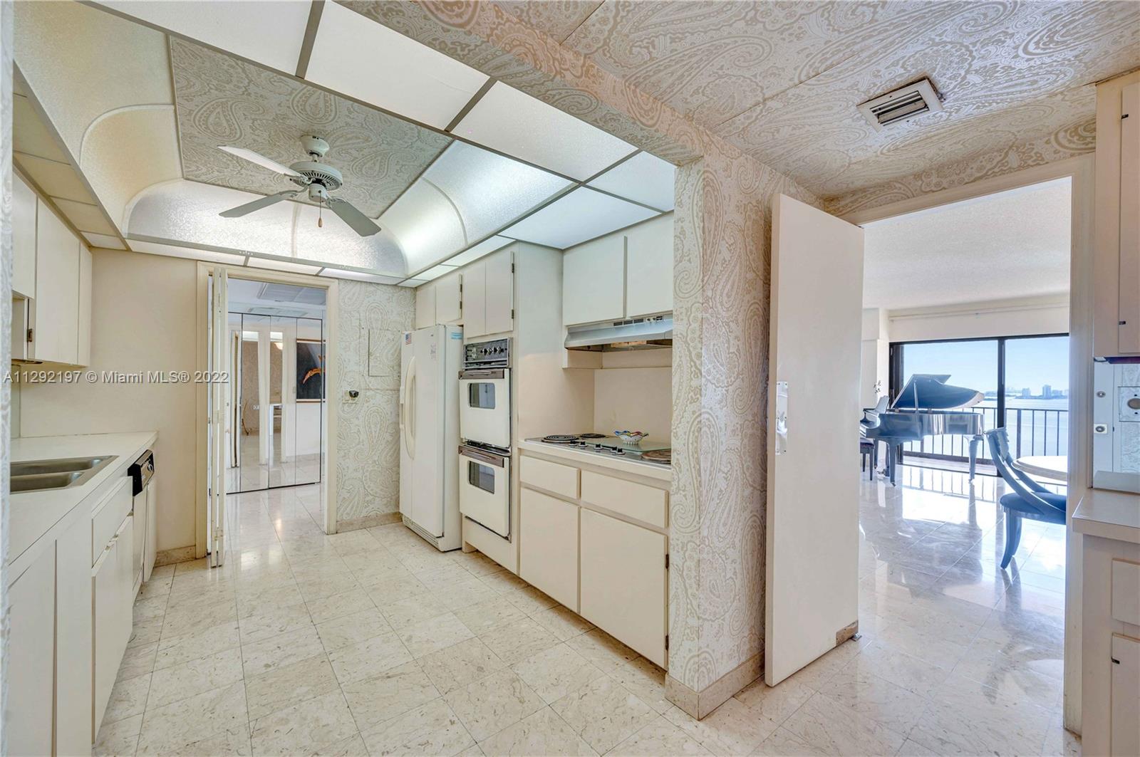 Kitchen with access to the living room