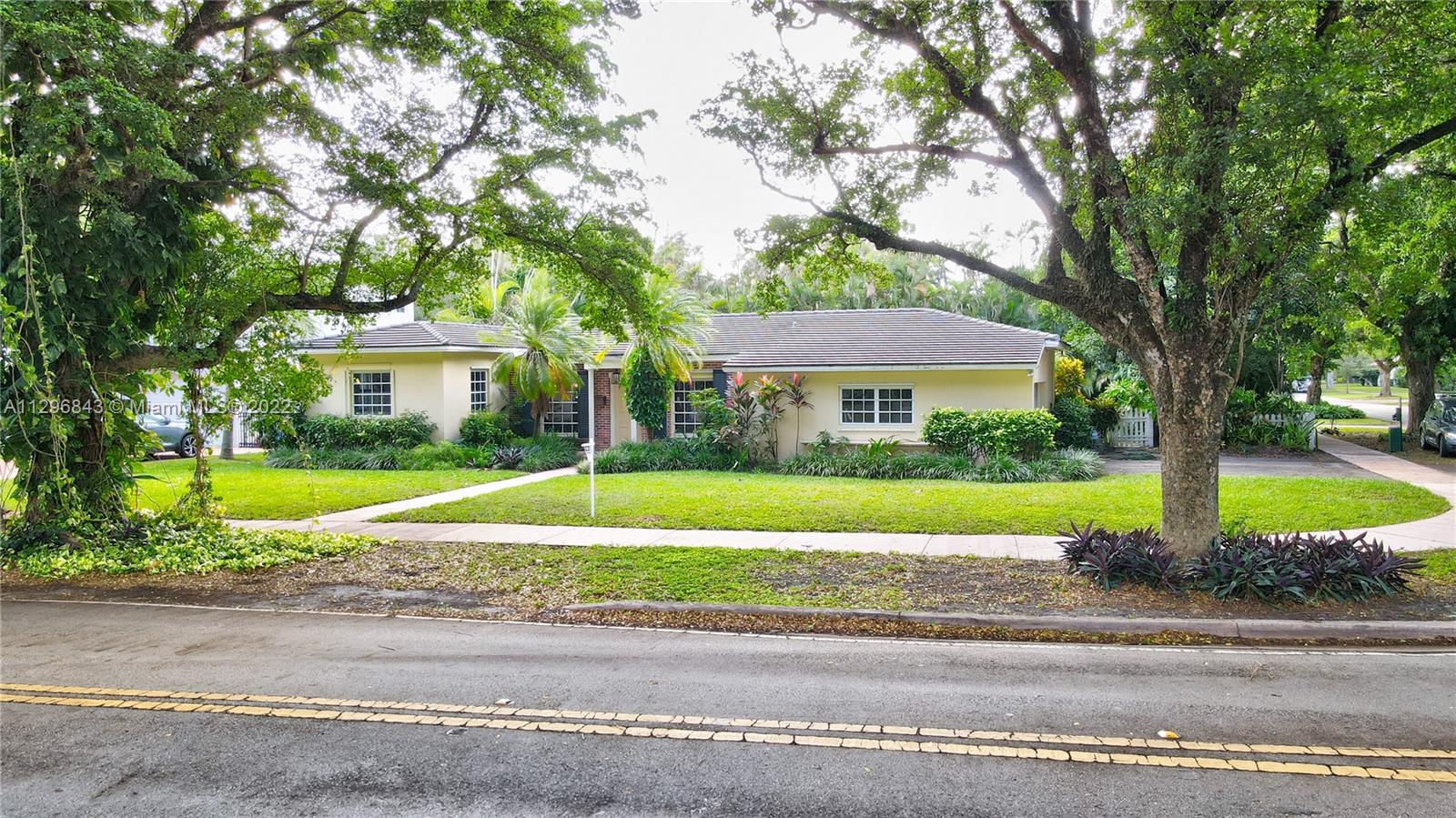 FABULOUS prime location for this charming 3 Bedroom 2 bath home on 11,100 sq ft oversized double corner lot on prestigious South Gables street. Live within walking or biking distance to University of Miami, downtown SOMI, or Sunset Elementary. House has newer roof(2015), original wood floors and a 2 car garage with plenty of room for a pool. Flood zone X.  Update with your own choices, expand existing structure, or build the new forever home you have been dreaming about. The possibilities are endless! More pictures to come.