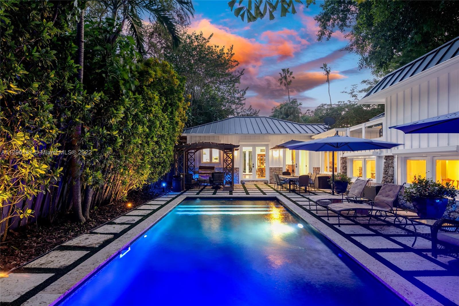 Nestled away in the heart of Coconut Grove, this spectacular and unique tropical oasis is surrounded by the most captivating landscaping, including a 150 year old Banyan Tree offering the most serene private escape for your family. Completely renovated in 2012, this home has it al! Including a gourmet kitchen, Viking + SubZero appliances, home office, large wine cellar, full house generator, propane tank, 2 septic tanks, spacious master suite with spa bath + large walk-in closet, impact windows/doors, fireplace and more. The scenic landscaping is paired with a resort-style pool and backyard. Follow the pathway through the trees to a spacious entertaining space and get lost in nature. This home is truly one of a kind!