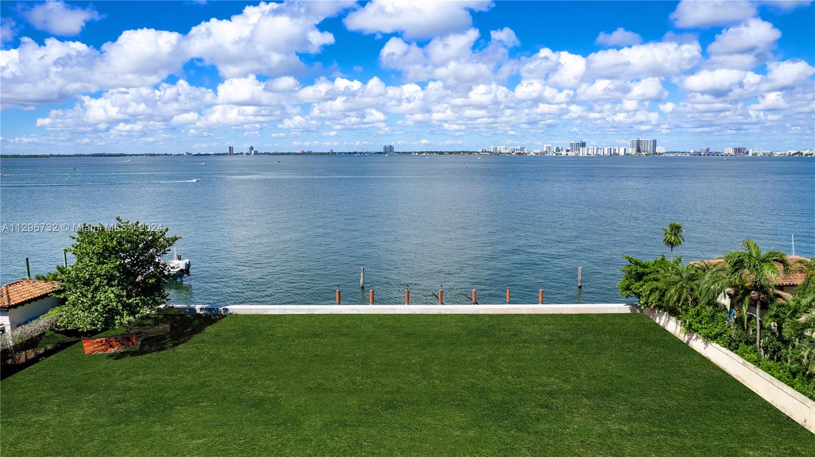 Build your dream mansion on Miami Beach’s most exclusive bayfront enclave, North Bay Rd, and enjoy spectacular water views and glorious sunsets over the Miami skyline and Biscayne Bay! This offering includes LAND with fully permitted plans by architect, Kobi Karp. The 27,334-SF lot – one of the best and largest waterfronts on North Bay Rd - boasts 150-FT of waterfront with a new seawall and dock. The plans are for a modern, 9-bedroom 14-bath home comprising 14,000-SF of lavish interiors, abundance of amenities, and exterior spaces - including a rooftop, positioned to capture the entirety of the dreamy views. Live among extravagant mansions and experience a world-class waterfront lifestyle. Located minutes to La Gorce Golf Club, beach, Sunset Harbour, Bal Harbour, Design District, Brickell.
