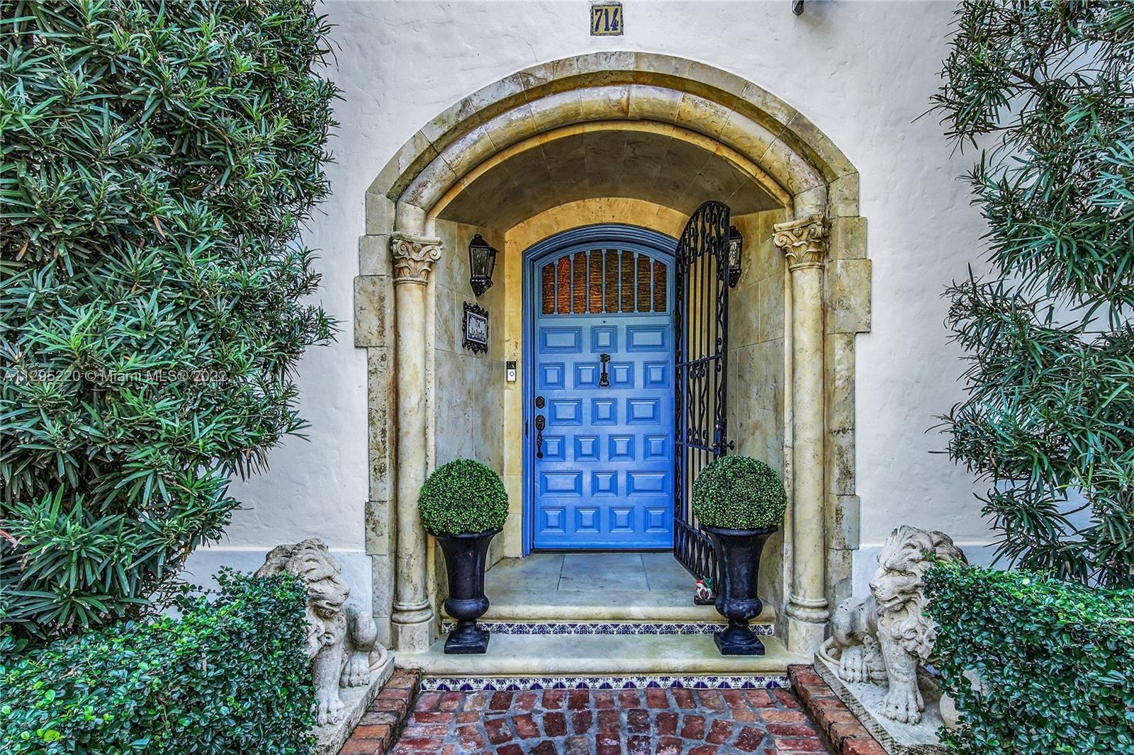 Beautiful Blue Door Flanked by Stone Lions