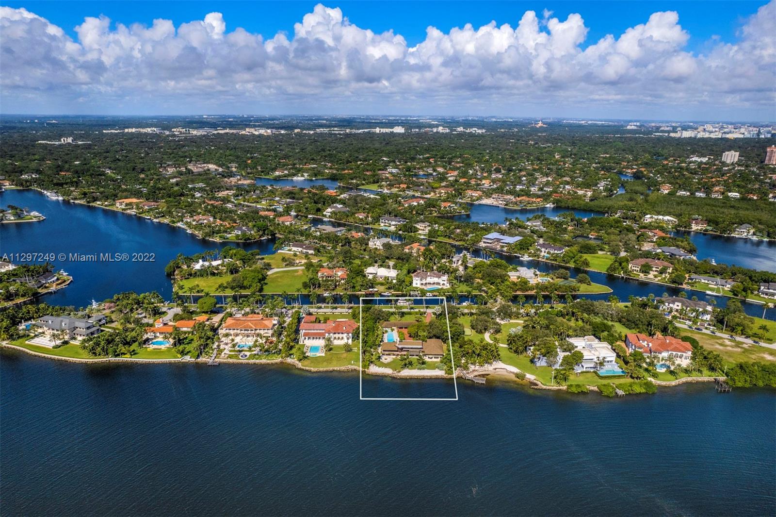 A once in a generation opportunity to own one of South Florida’s premiere properties inside the gated and exclusive community of Gables Estates.  This almost 2 acre property, with 200 feet of direct water frontage on Biscayne Bay, allows one to enjoy expansive and unobstructed views out to Key Biscayne, Stiltsville and the ocean. An additional 200 feet of seawall, on a private and protected waterway, is located in the back of the property to dock your yacht.  Build your dream home or renovate the existing property. The possibilities… like the views…are endless.  This is truly a one of a kind property that is rarely ever on the market.