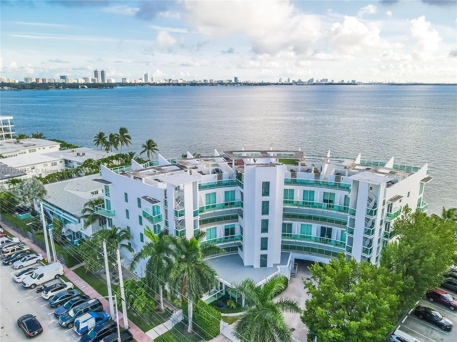 Amazing duplex style condo with endless open bay view and a separate private roof top terrace to enjoy the best sunsets of Miami Beach!. If you are looking for a great location just minutes from the beach and minutes from downtown Brickell but with a privacy of a townhouse style, this is for you. 
First floor will welcome you with a large open kitchen with SS appliances, double high impact glass sliding doors with large balcony facing the bay, second floor all natural wooden flooring with open master bedroom loft style, marble bathroom. Split floor plan for second guest bedroom and bathroom and additional second balcony. This unique unit comes with a private gated terrace that could be used as Yoga room, solarium, party room with unobstructed bay views and skyline. Come and make it yours!
