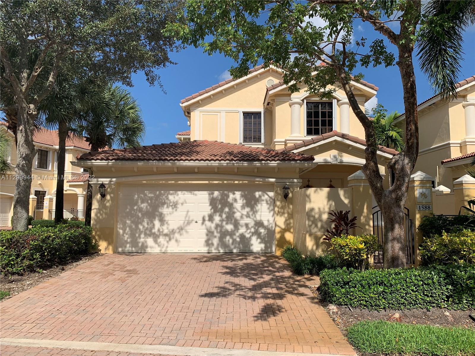 This lovely property is located in the heart of Weston, within walking distance to Town Center, and close to many stores, restaurants, and pharmacies. It is located in a gated community, it has a 2-car garage and a screened balcony. The unit features accordion shutters, new kitchen appliances, and granite countertops. It also features a tankless water heater. Safe and quiet neighborhood, the house is well maintained, and it just added a new AC, new washer, and dryer.
