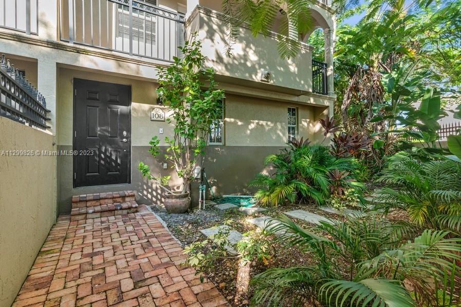 Enjoy the Grove lifestyle in this lovely updated 2 bed/2.5 bath townhome in the private gated community of Villas of Maydana. This amazing corner unit has a walled courtyard with lush vegetation and tropical landscaping with incredible wrapped around covered balconies. This unit features a newly updated custom kitchen featuring wood cabinetry, granite countertops, stainless steel appliances and bar with room for counter stools. Newly updated floors throughout, freshly painted, new A/C, all new light fixtures and ceiling fans. The GF has a 2-car garage & laundry area. 
Conveniently and centrally located, close to fine dining, boutiques, cafes and parks & marinas. Minutes away from downtown, MIA airport, Coral Gables, Key Biscayne and the beaches. Don't let this unique home slip away!