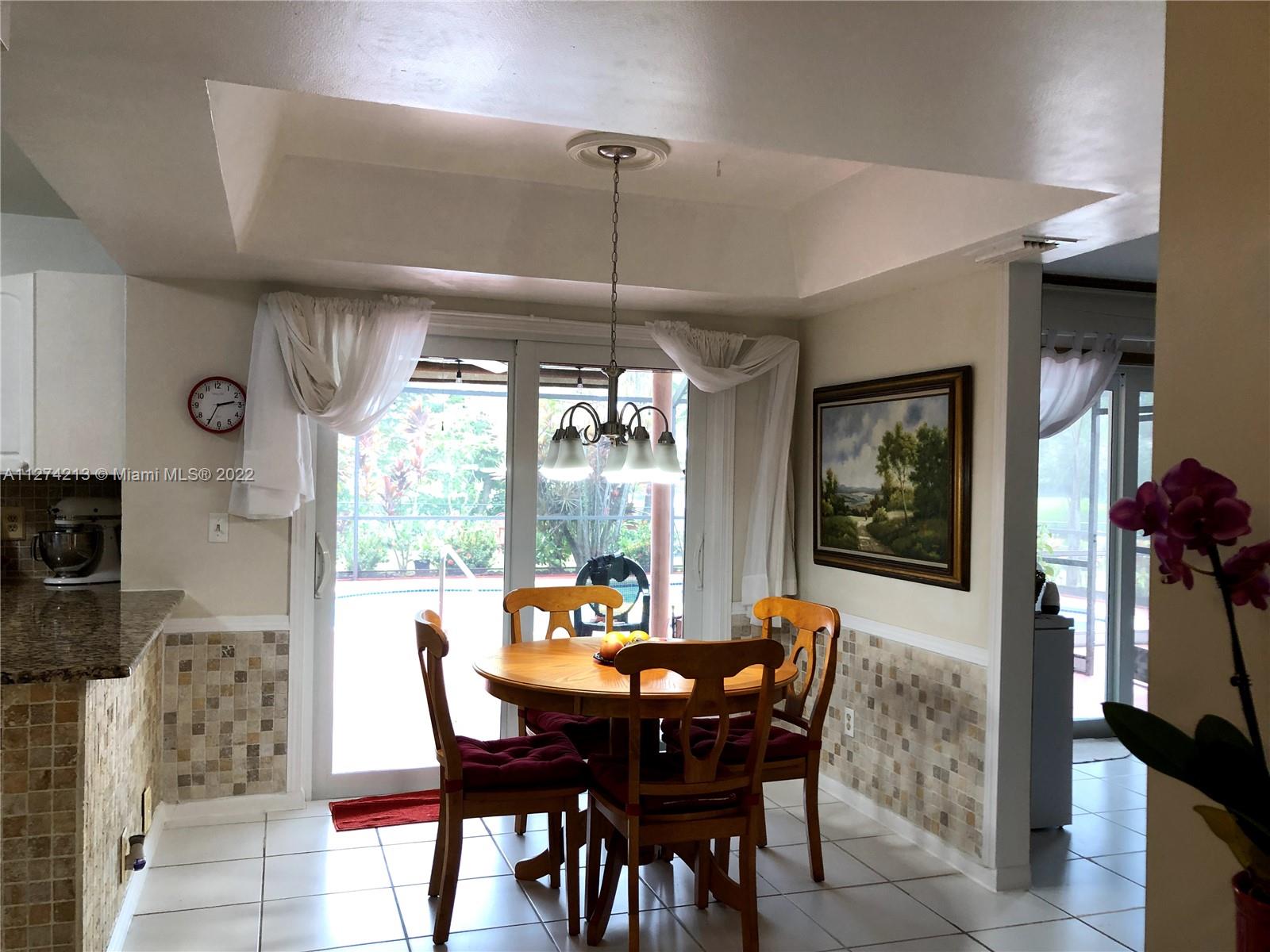 A perfect spot for a quick meal, casual family dining or on the go dinners. Lovely view of pool, lake, and oversize backyard.