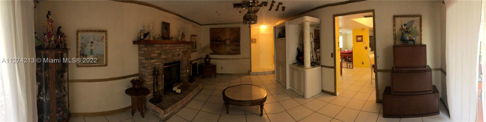 Family Room with Brick Fireplace.