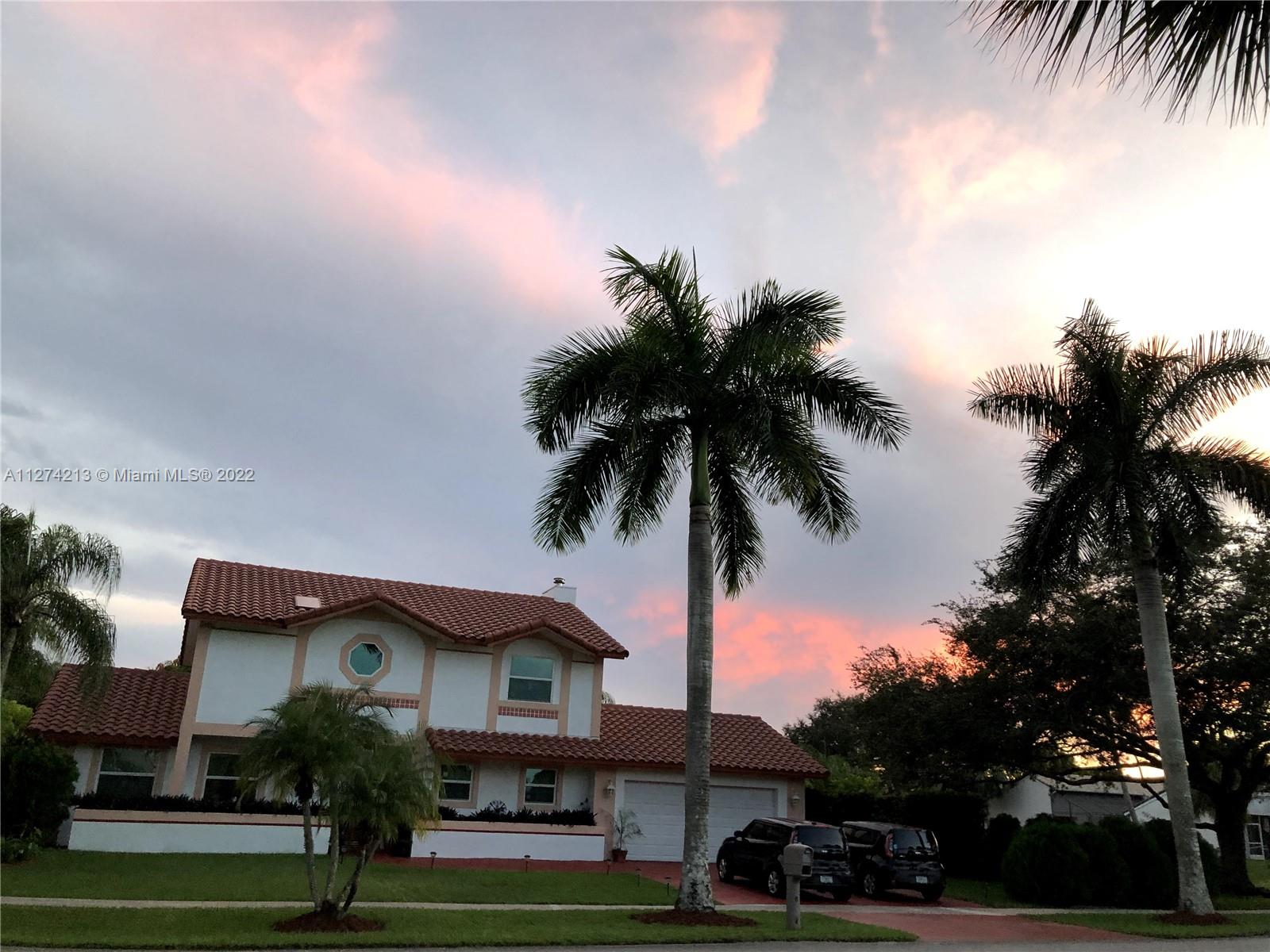 Spacious home that is  practical, family friendly. Home features hurricane resistant impact windows throughout entire house (installed 2021), Barrel tile roof (installed 2018), privacy fence, and hedges. You will love the spacious backyard with ample room for family entertainment and barbecues in the enclosed screen patio!